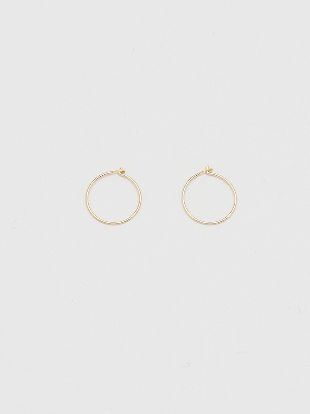 Full view flay lay of 14K 303 Mini Hoops Earrings Bagatiba 