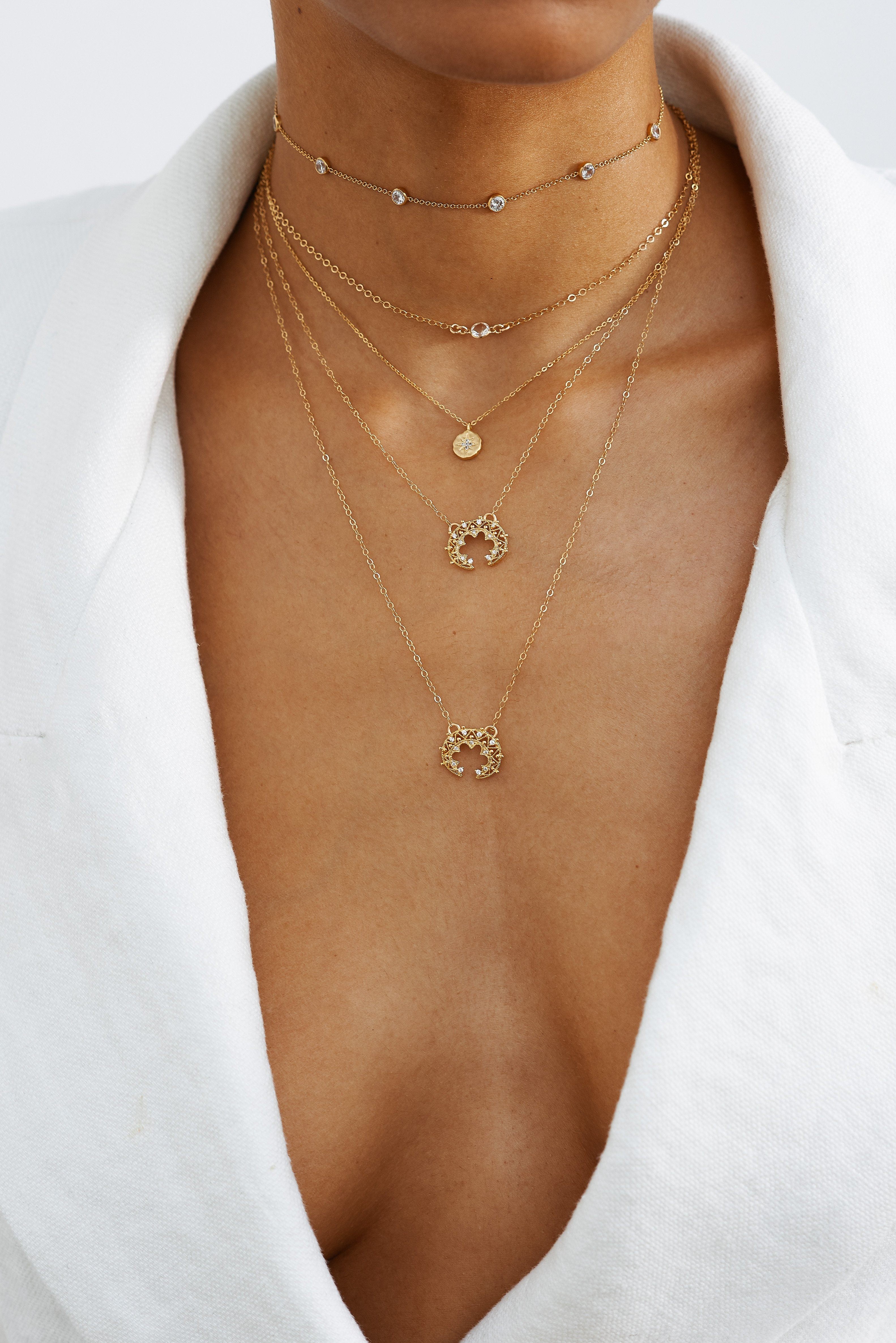 Cropped view on model of 14K Emma Choker layered with 4 other chains  Bagatiba 