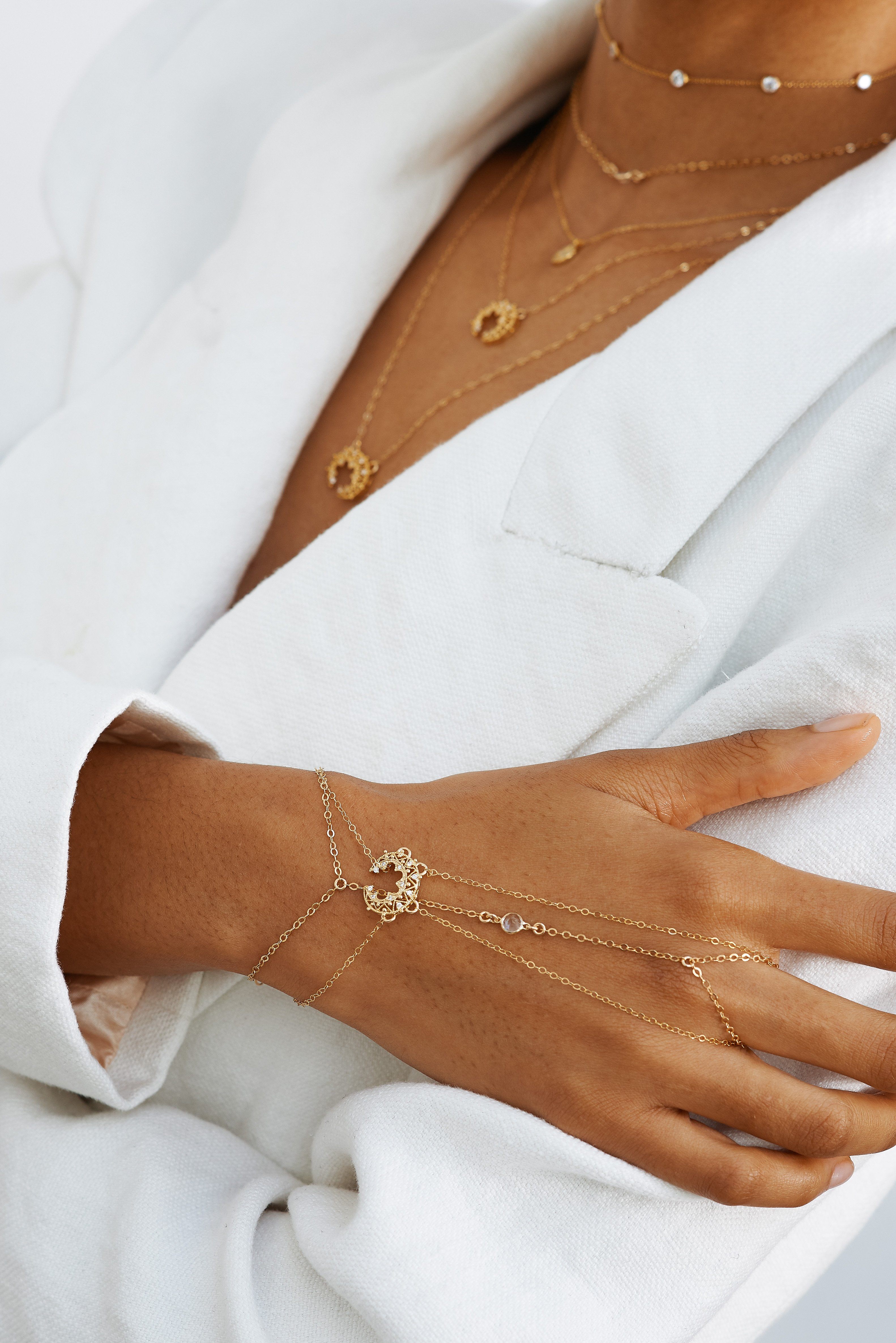 Cropped model view of hand & neck 14K Emma Finger Bracelet styled with similar styles  Bagatiba 