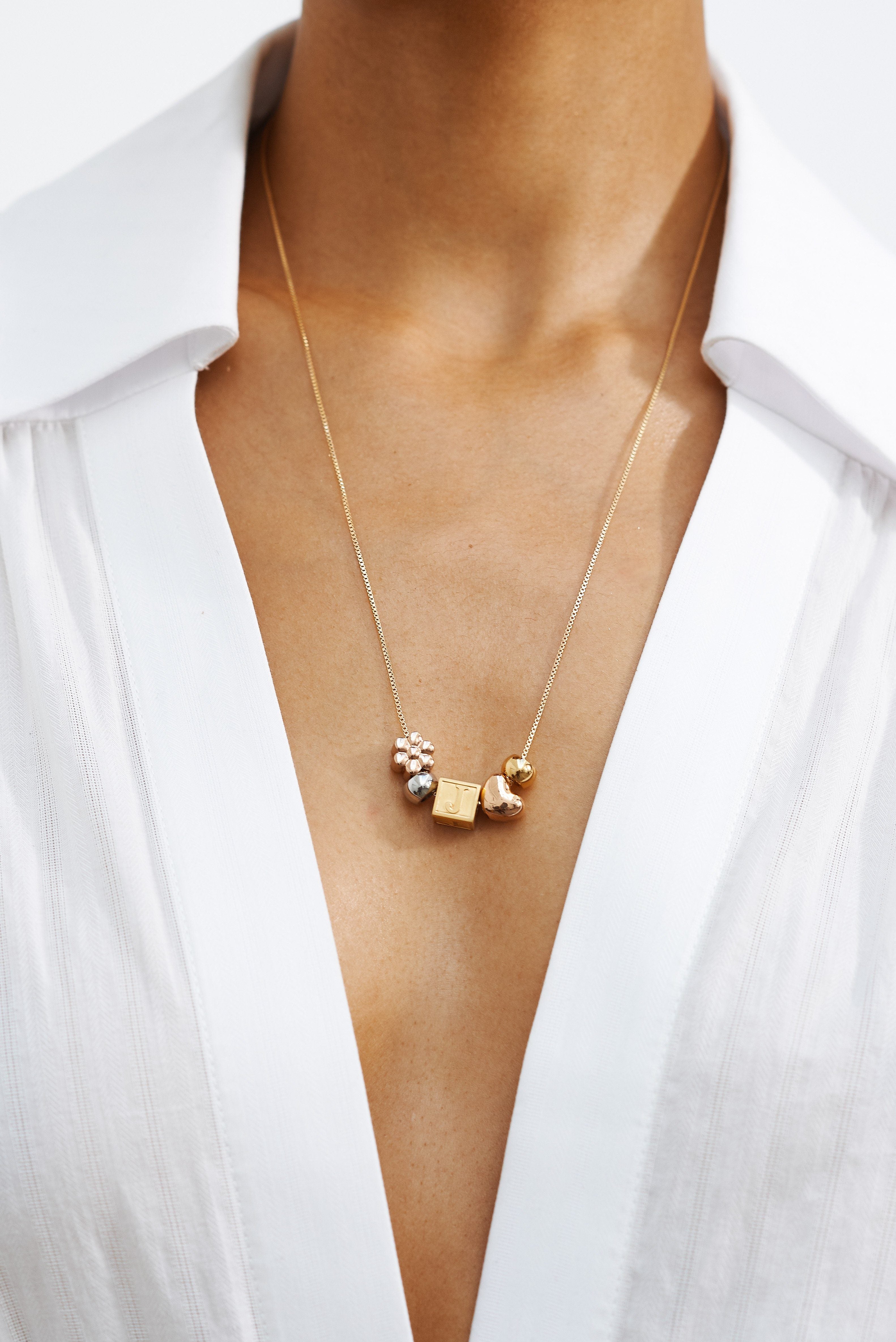 Close up model wearing "J" Letter Block letter and multi bead set on simple chain   Bagatiba 