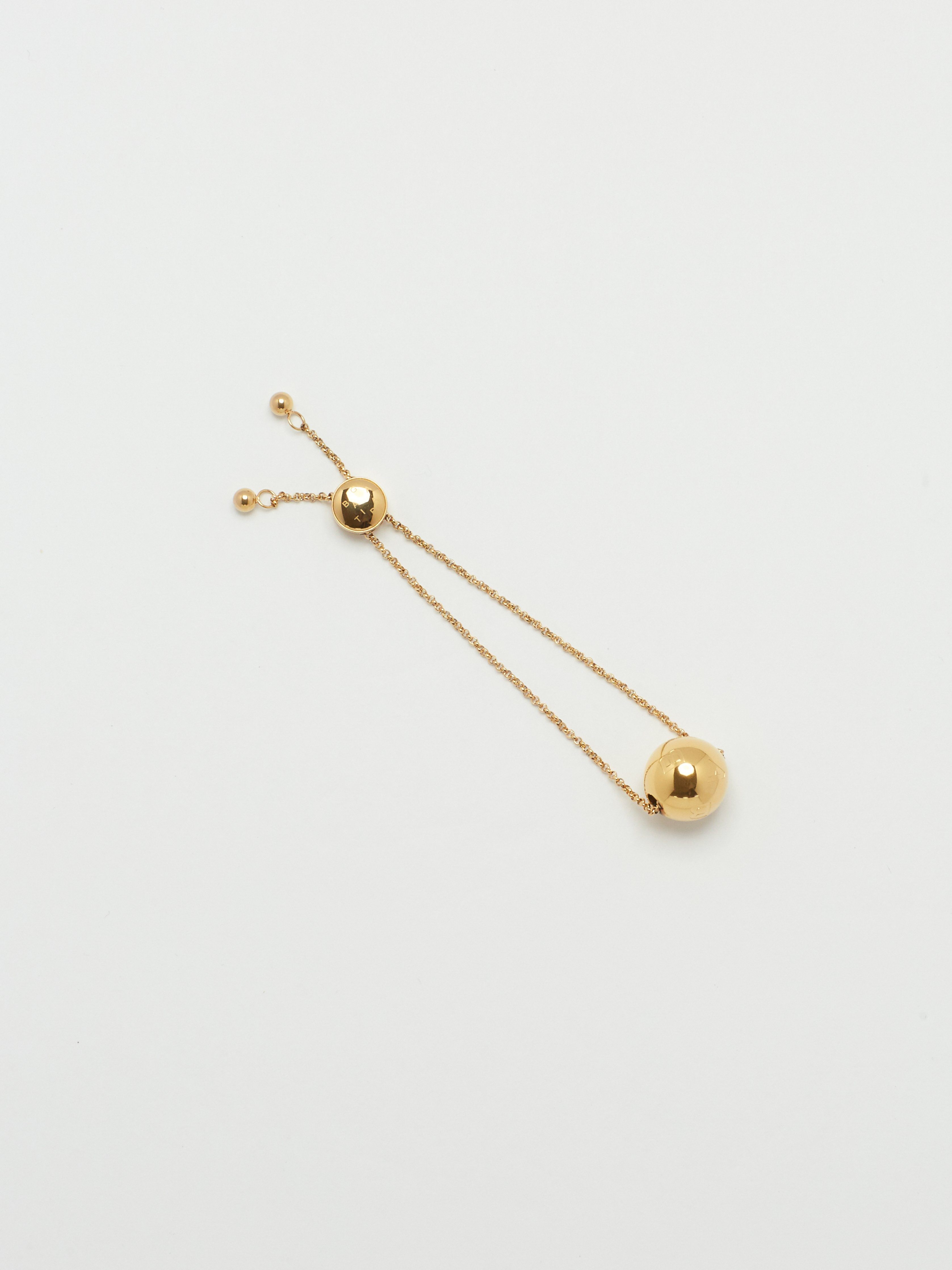 Full view flat lay and Adjustable Sphere Bracelet bagatiba 