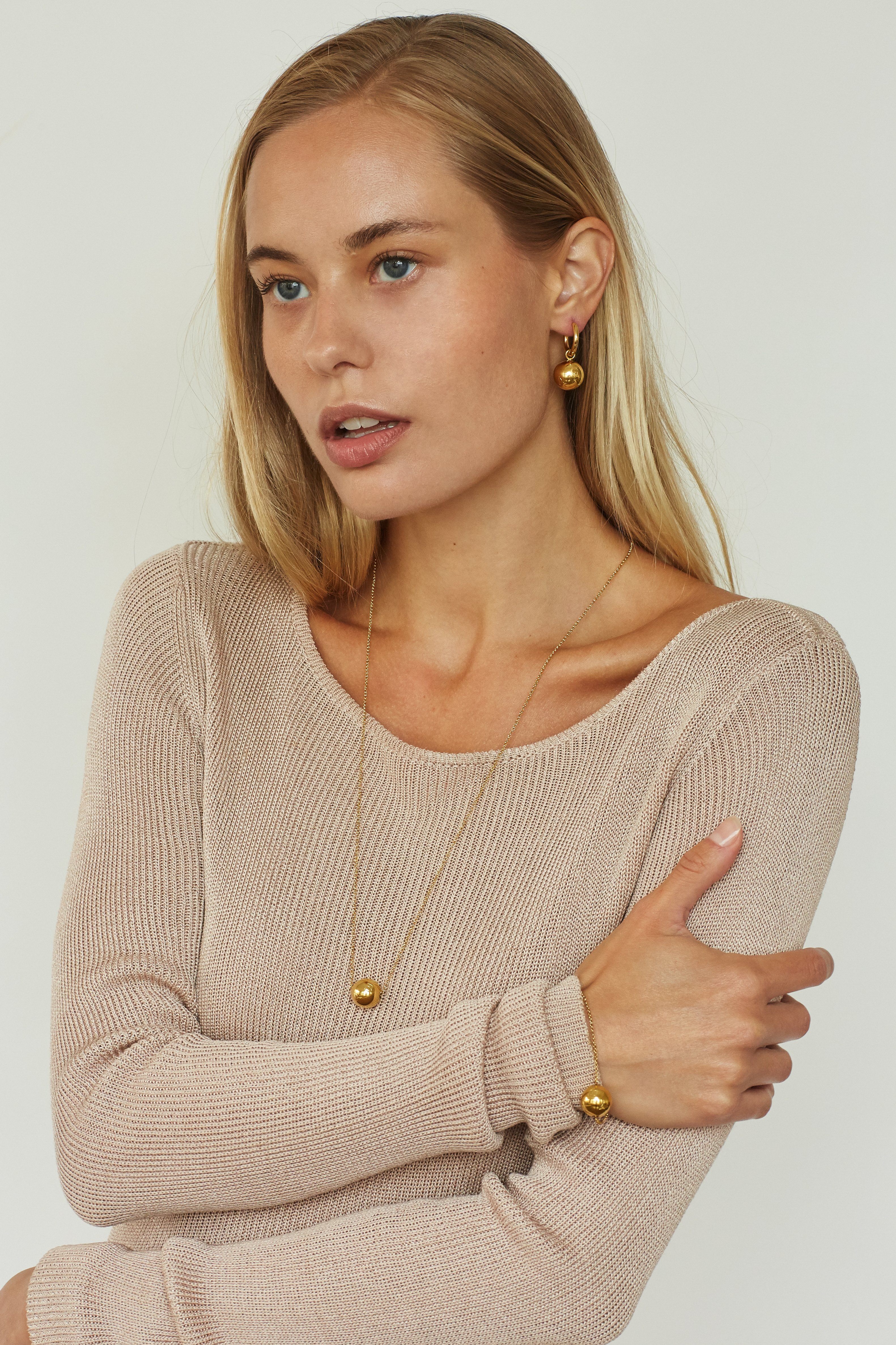 Model profile view wearing Adjustable Sphere Bracelet bagatiba 