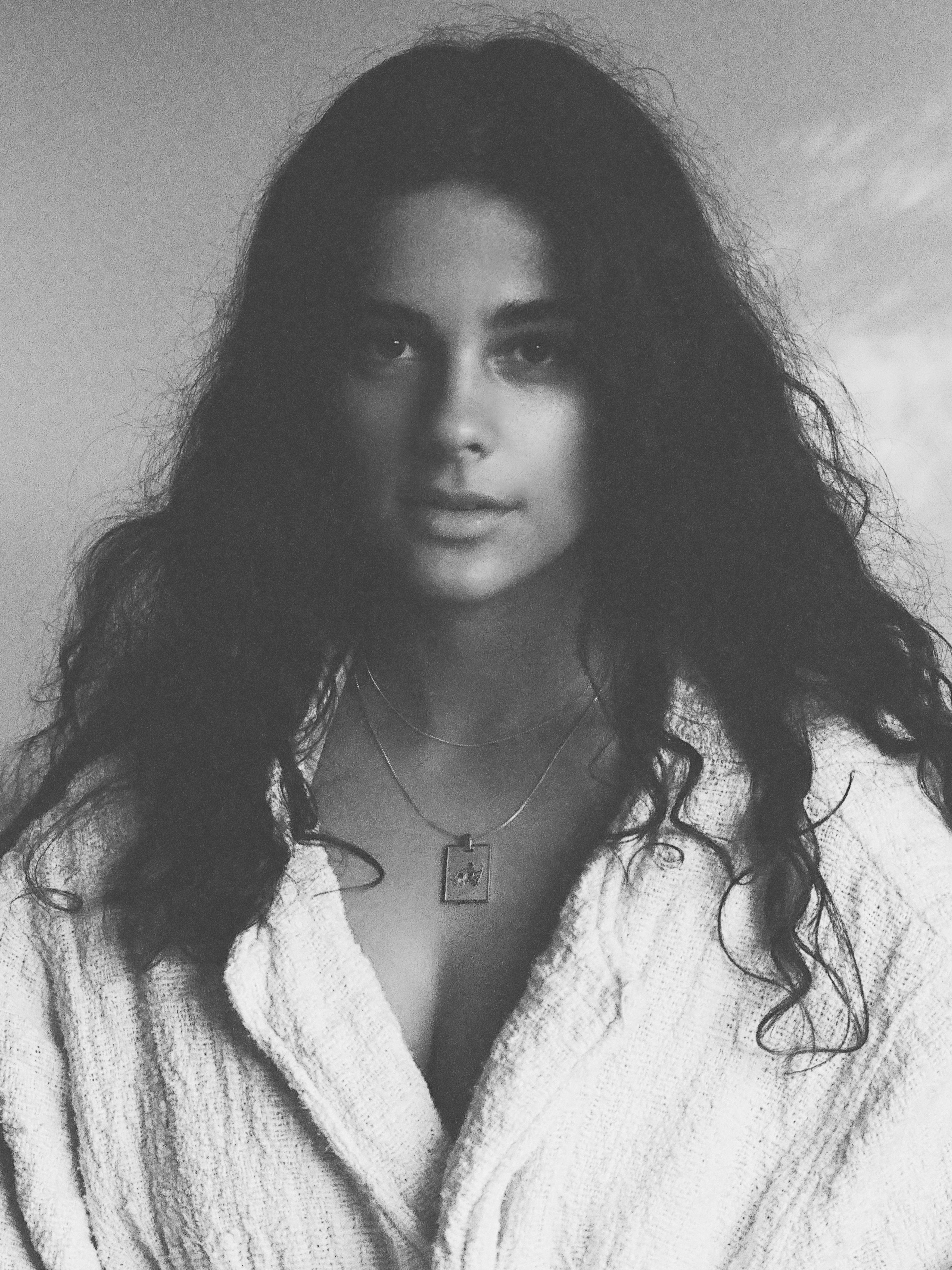 Black and White photo of model wearing Aquarius Charm charm Bagatiba 