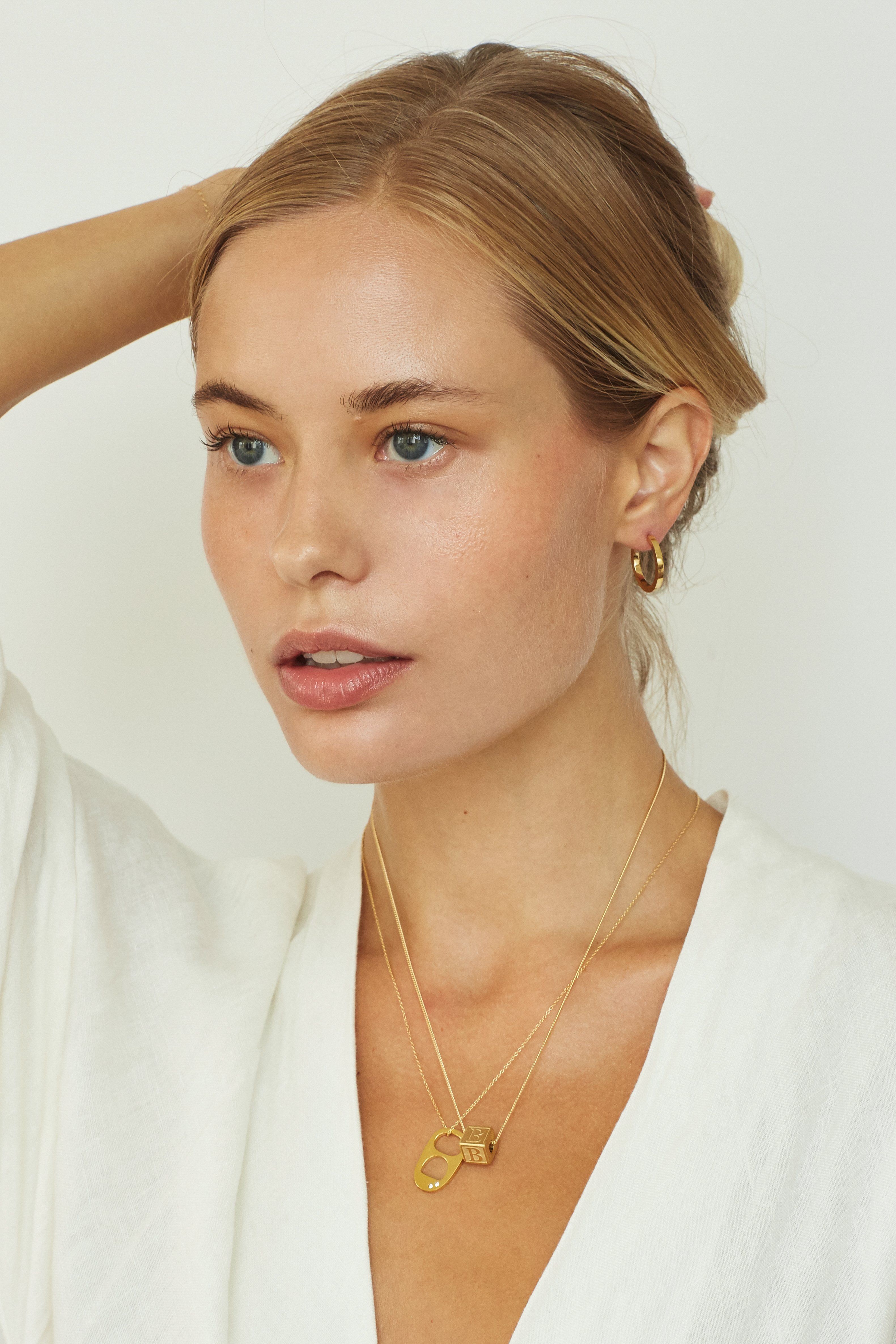 Model wearing "B" Letter Block letter on chain layered with soda tab charm on a chain  Bagatiba 