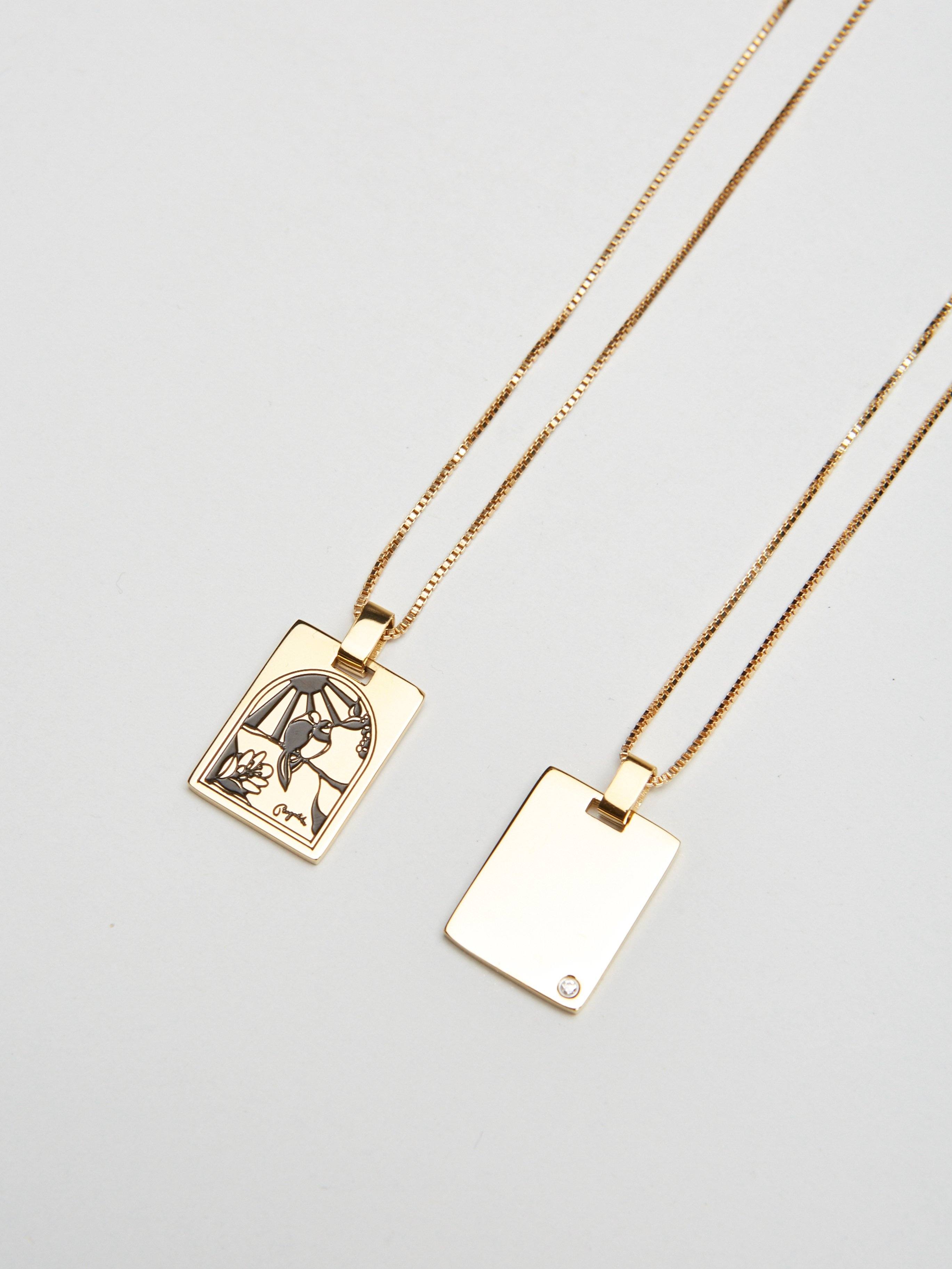 Flat lay view of both sides of Bagatiba Long Cage Necklace Necklace Bagatiba 