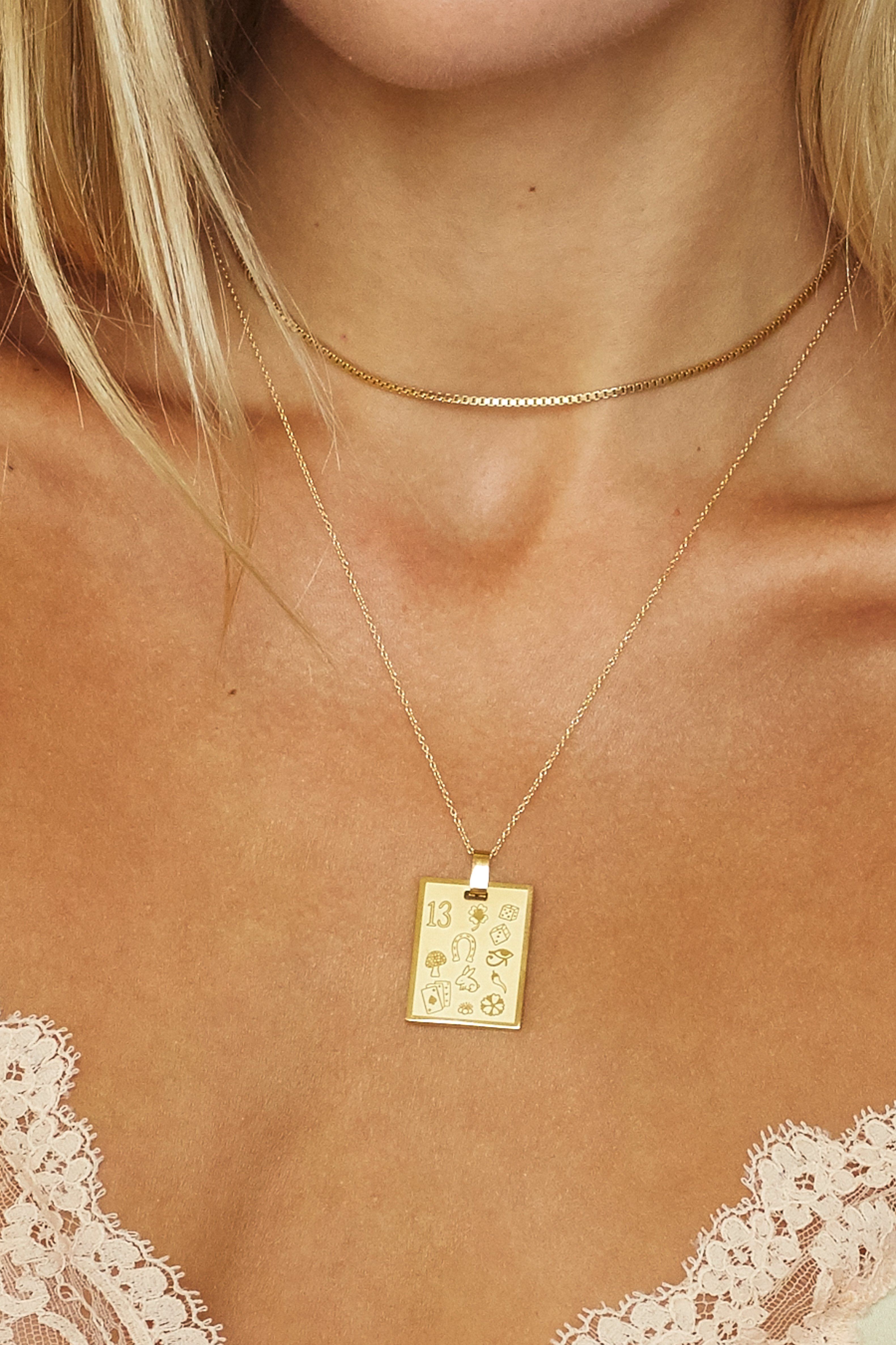 Cropped view on Model of Bagatiba Lucky Charm Necklace paired with Vintage Square Choker  Bagatiba 