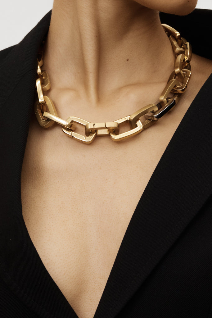 Cropped view on Model of Brushed Gold Cara Clip Necklace Bagatiba 