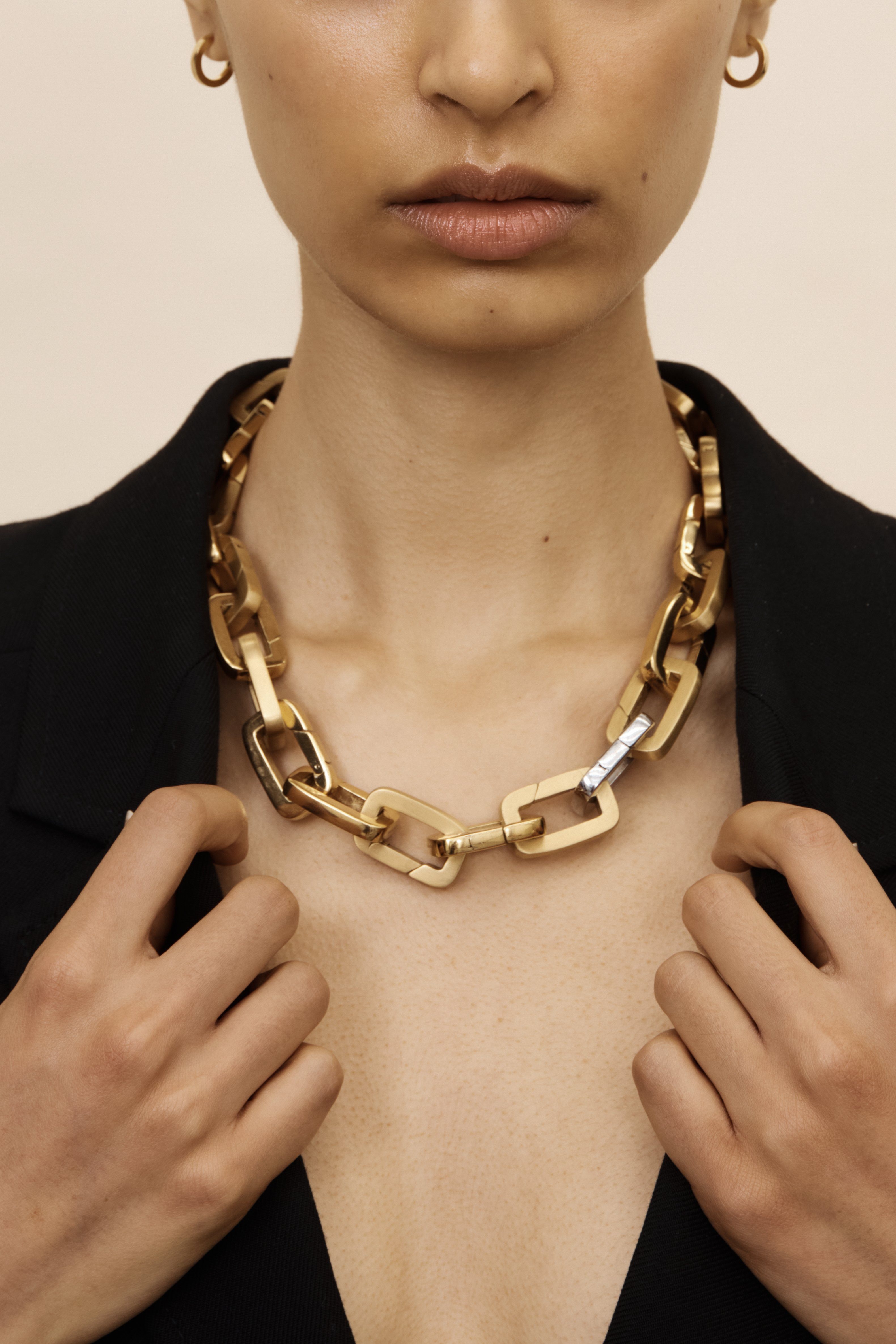 Cropped view of Model wearing a Necklace made of Brushed Gold Cara Clips, Gold Cara Clips & 1 Silver Car Clip  Bagatiba 