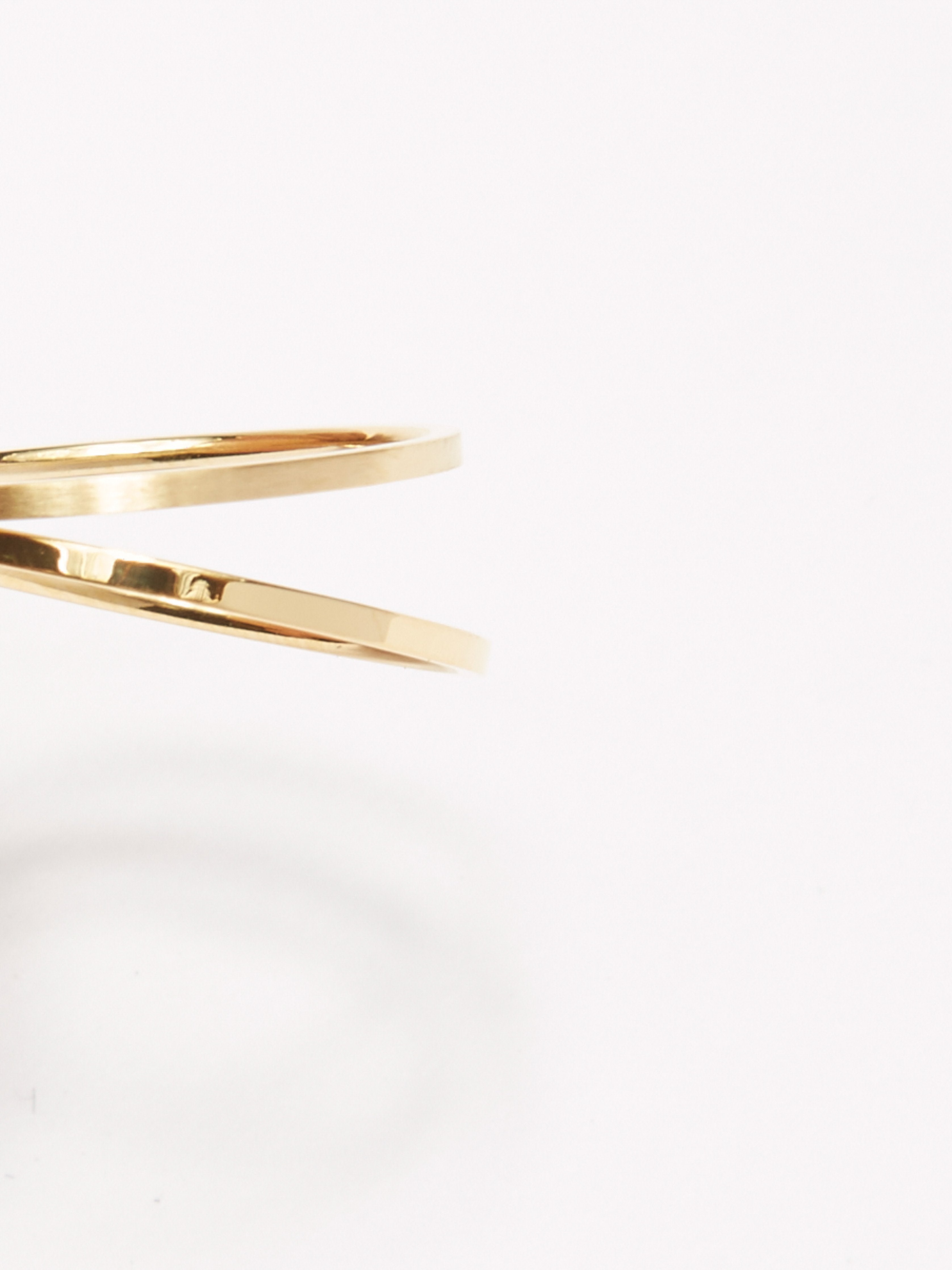 Cropped flat lay view of Brushed Gold Ring and Polished Gold Ring Bagatiba 