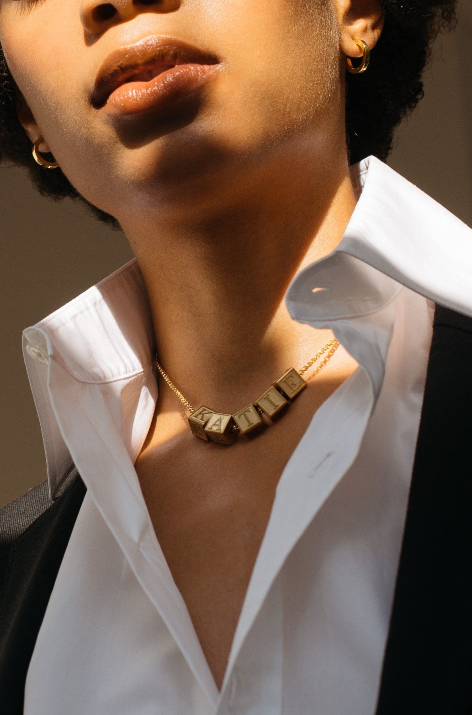 Model wearing 5 Letter Block letters on chain Bagatiba