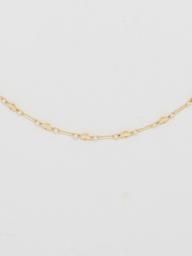 Cropped flat lay view of Cross Chain Choker Choker Bagatiba 