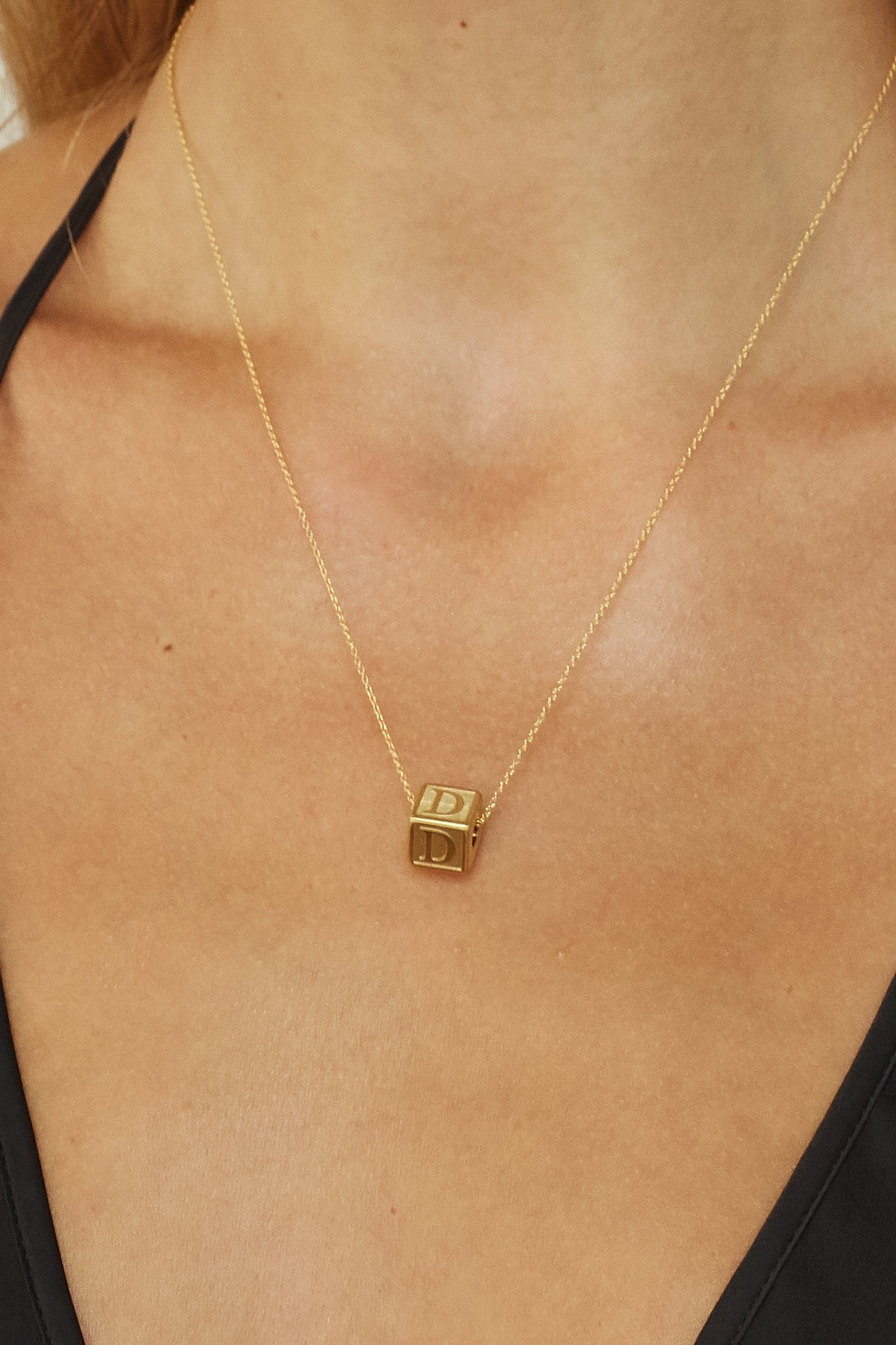 Close up on model "D" Letter Block letter on simple chain  Bagatiba 