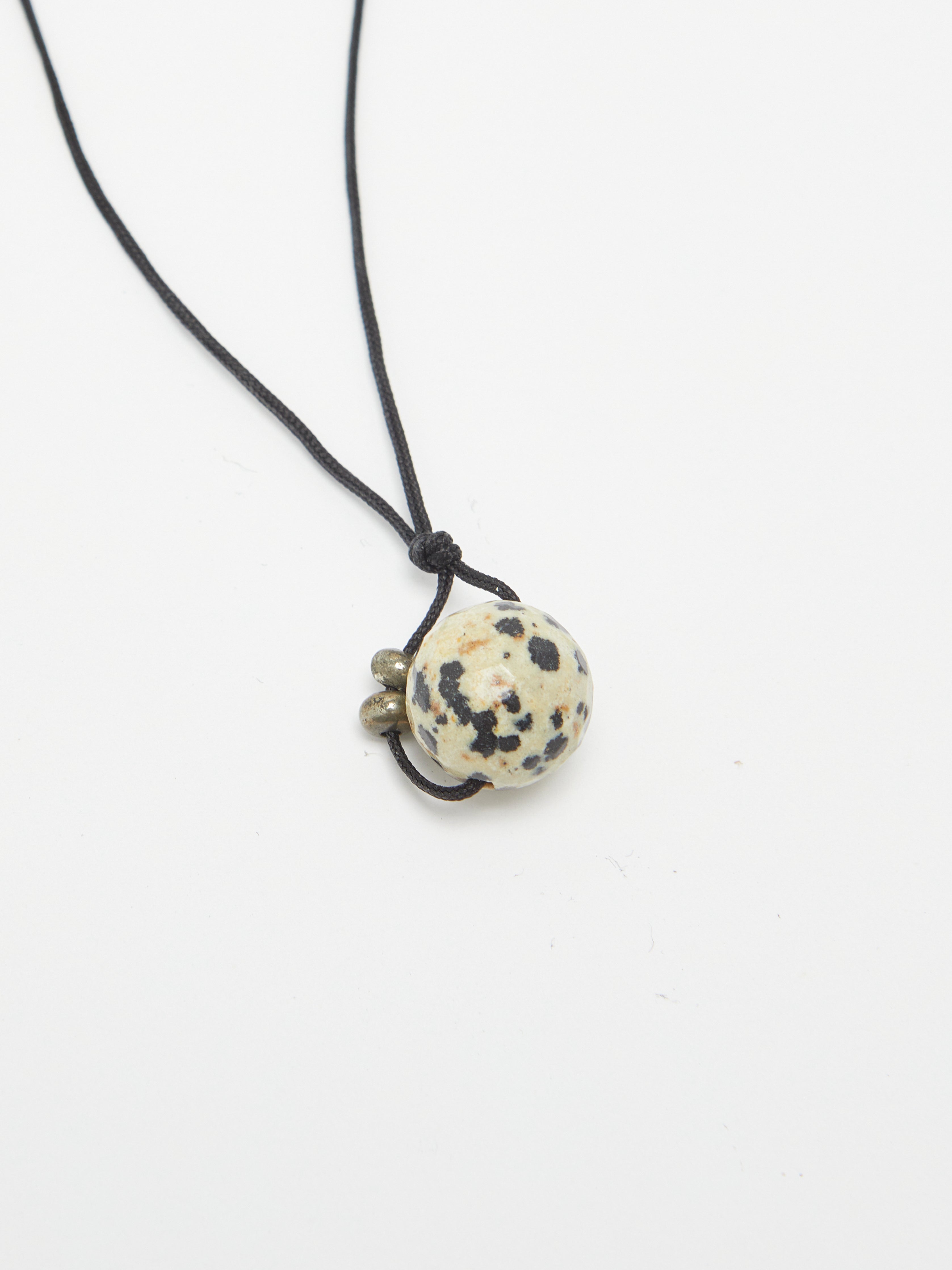 Dalmatian Drop Necklace necklace flat lay close up