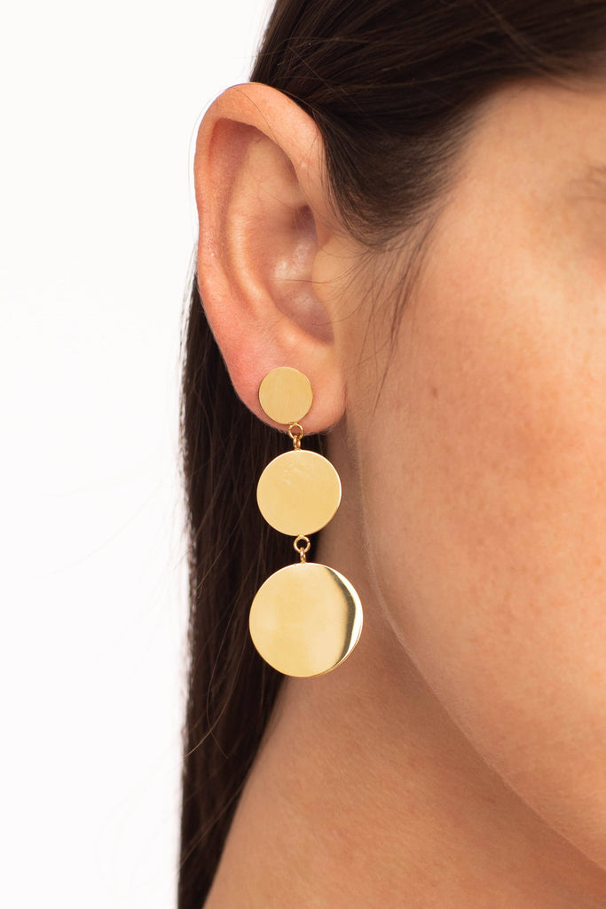 Cropped view of model's ear with Dangle Dot Earrings Earrings Bagatiba 