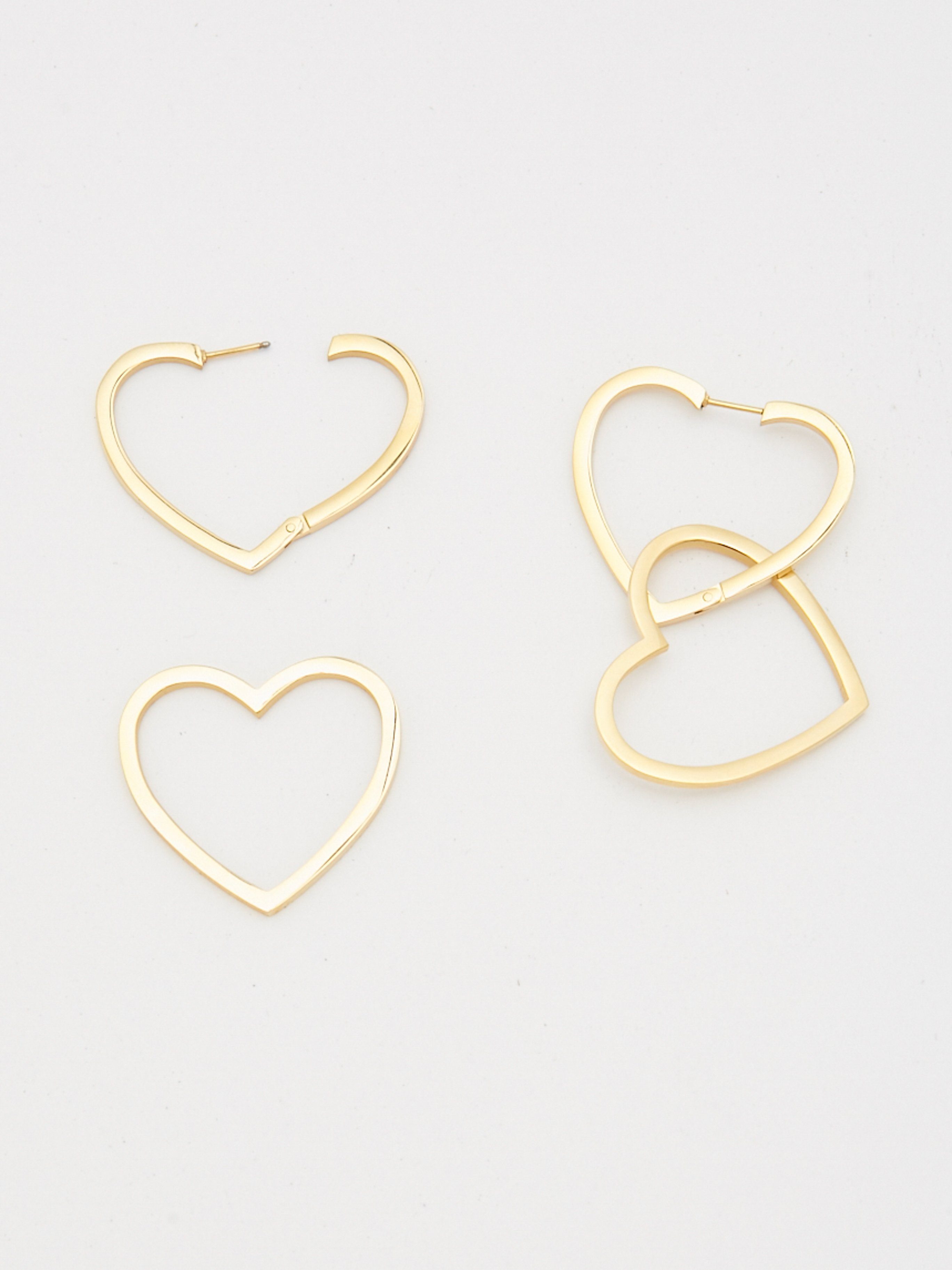 Cropped flat lay detail shot of Double Heart Hoops Earrings bagatiba 