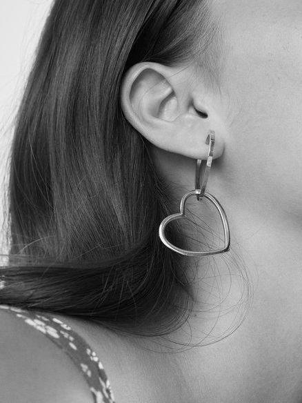 Black and White image of Model's ear with Double Heart Hoops Earrings bagatiba 