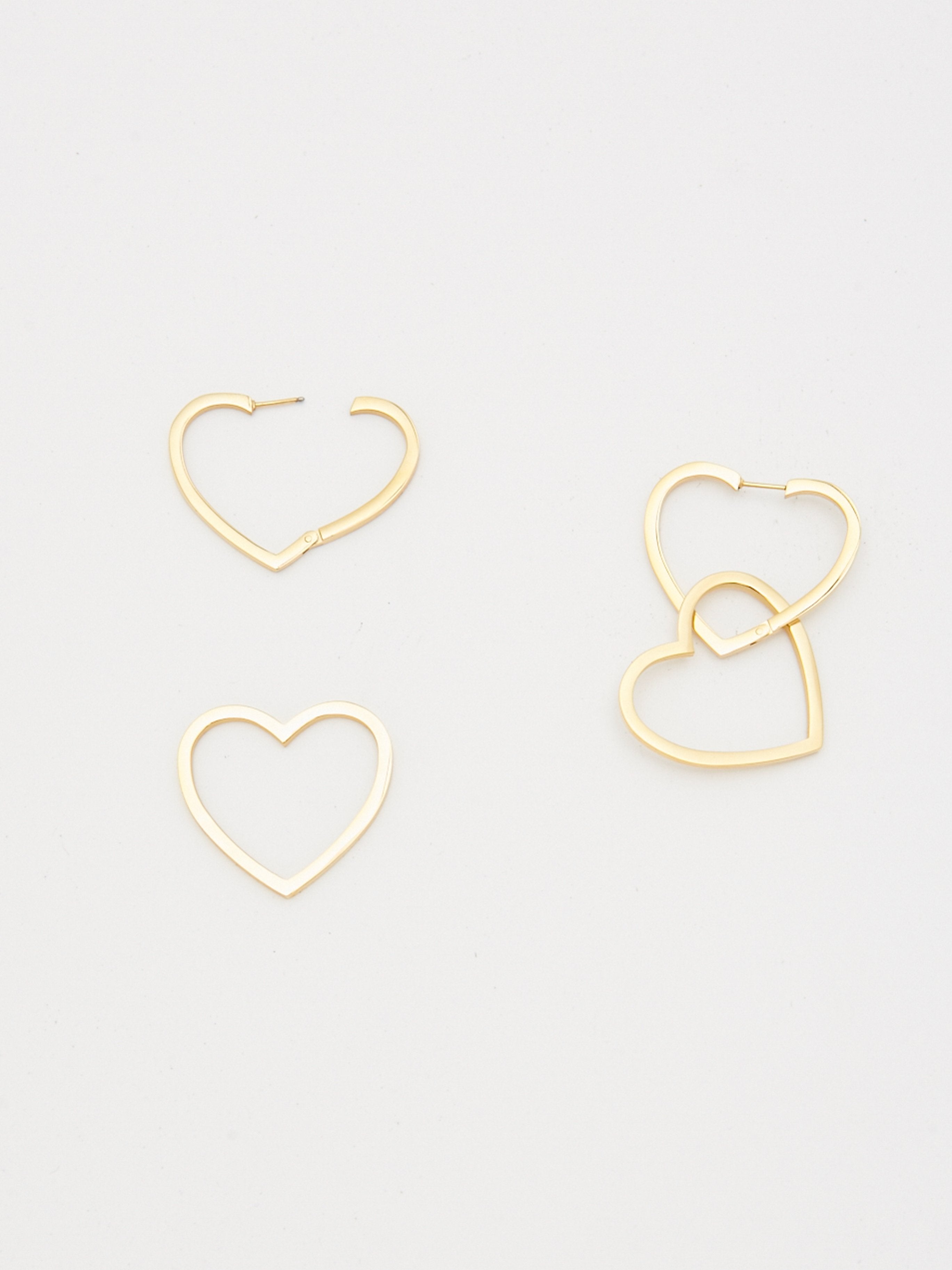 Detail flat lay photo of Double Heart Hoops Earrings bagatiba 
