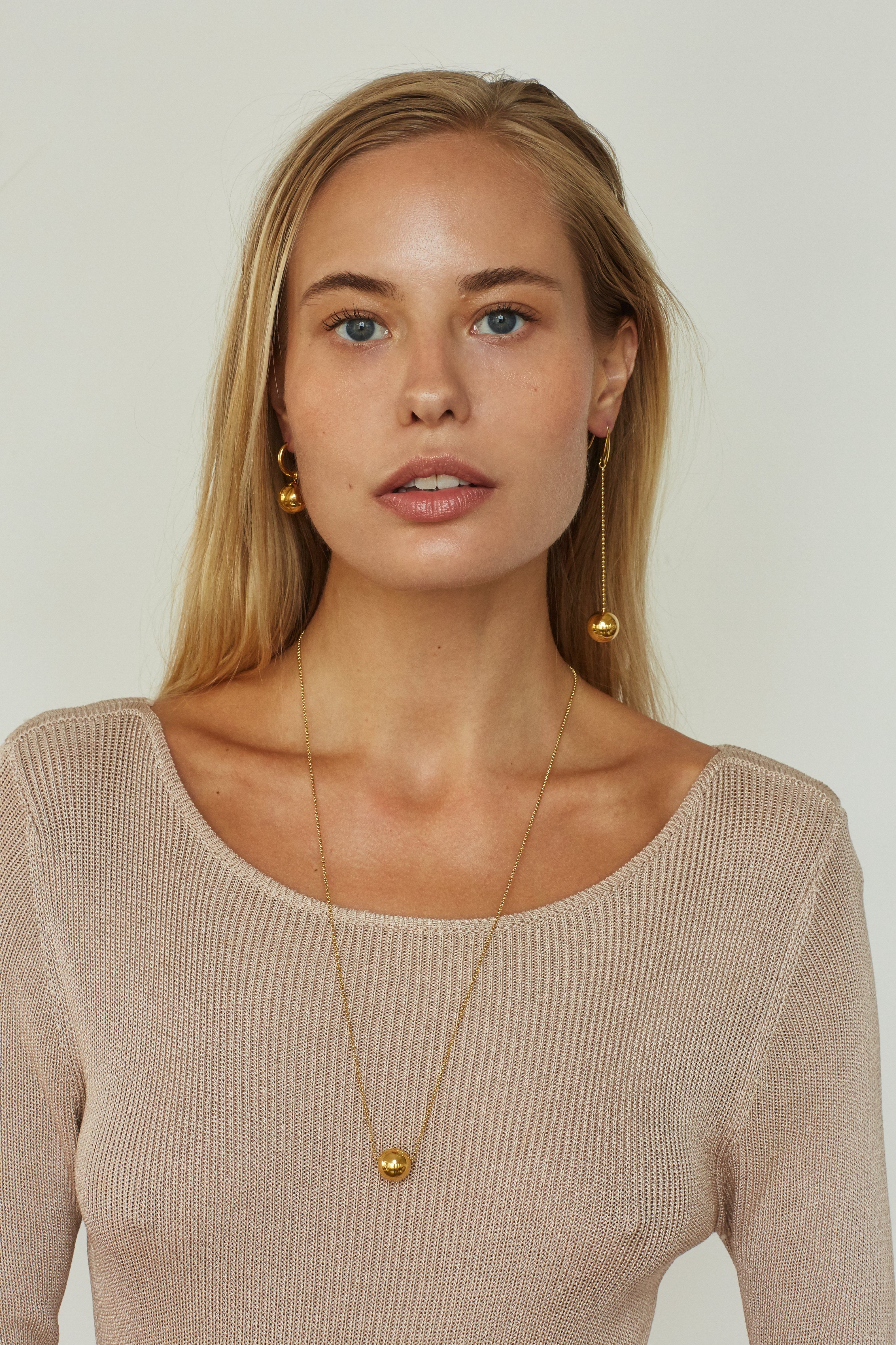 Model wearing Drop Sphere Earring & Sphere Hoop  Earrings bagatiba 