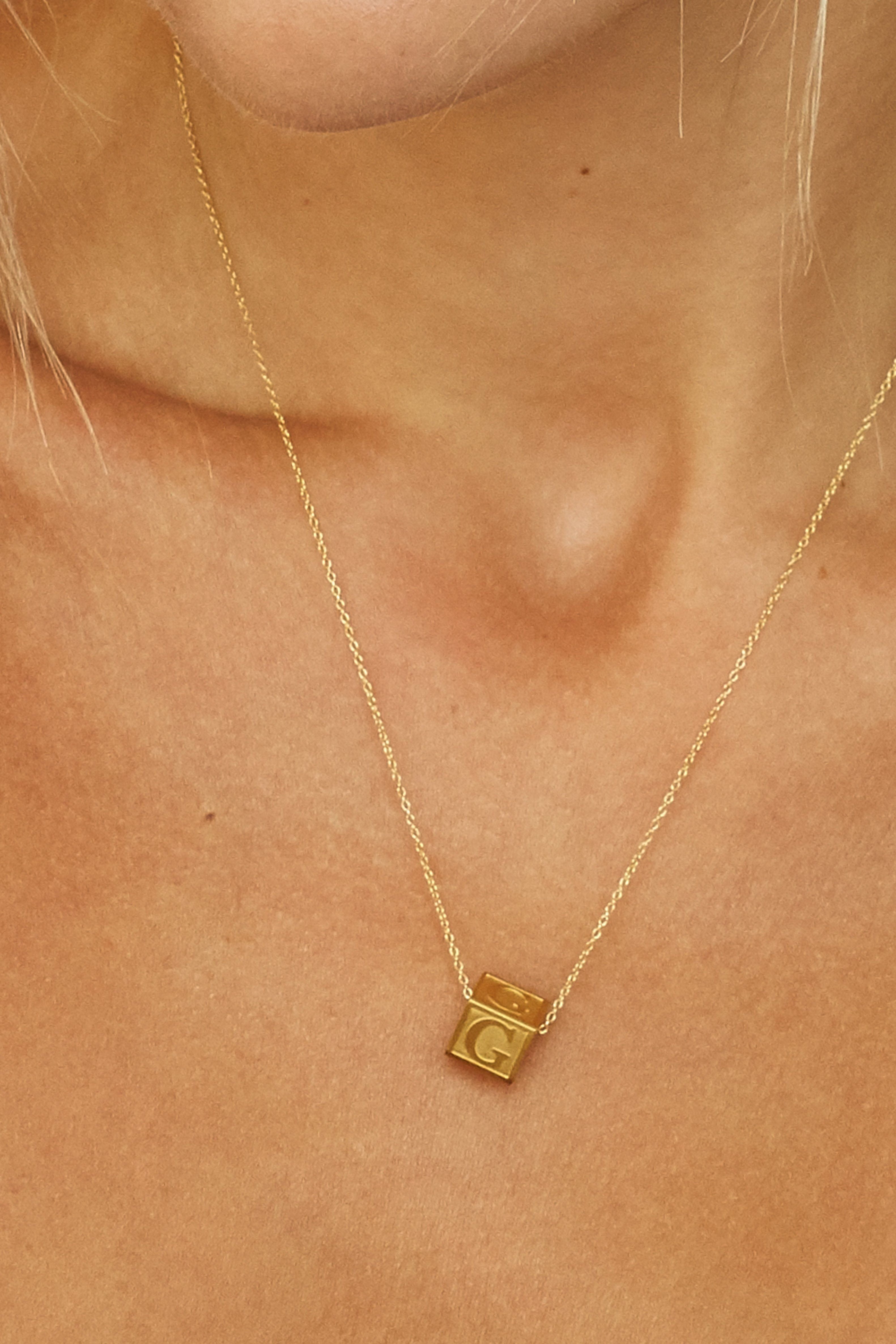 Close up of model wearing "G" Letter Block letter on 16"+2" simple chain Bagatiba 