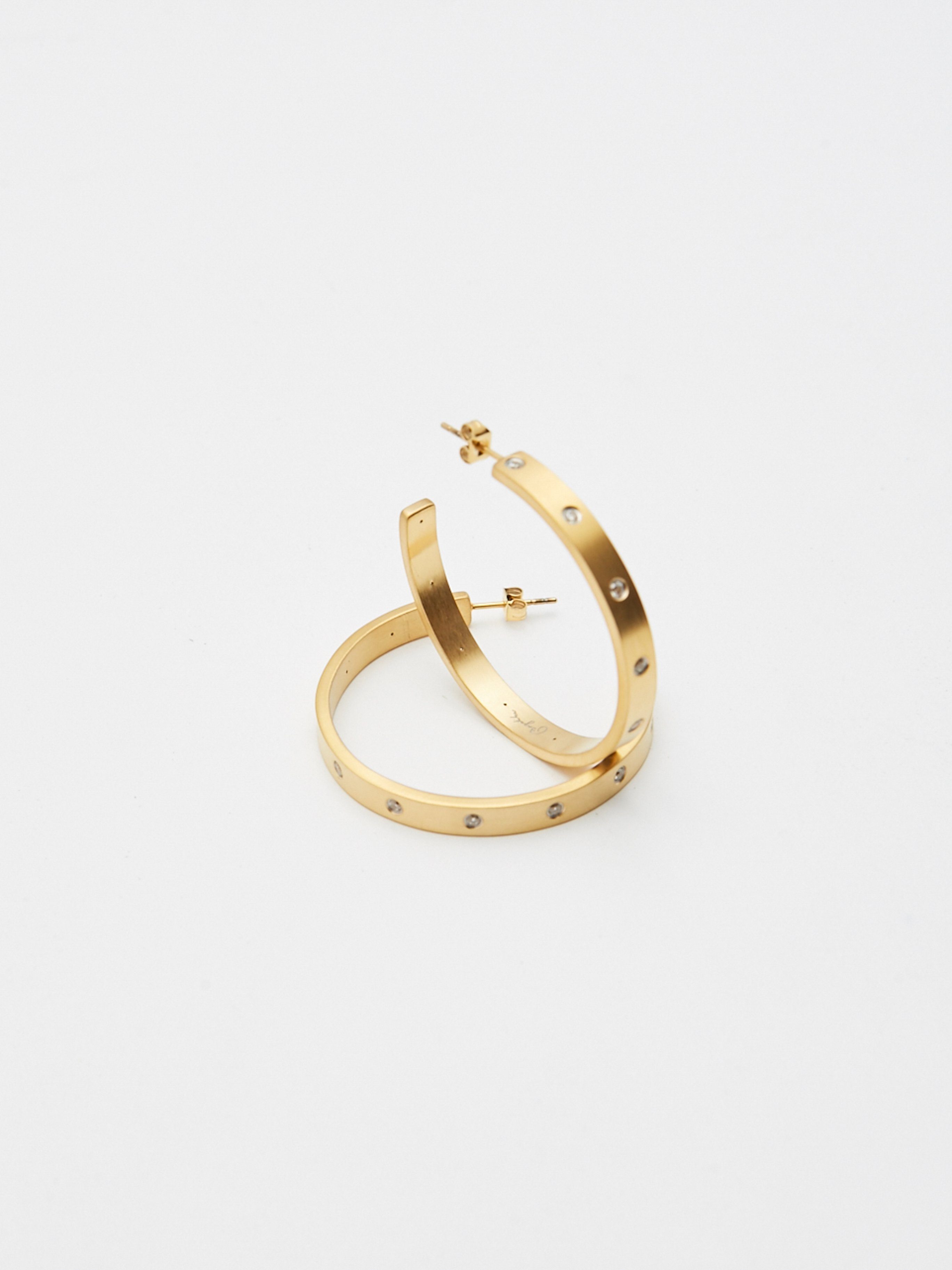 Flat lay view of Gemma Diamond Hoops Earrings bagatiba 