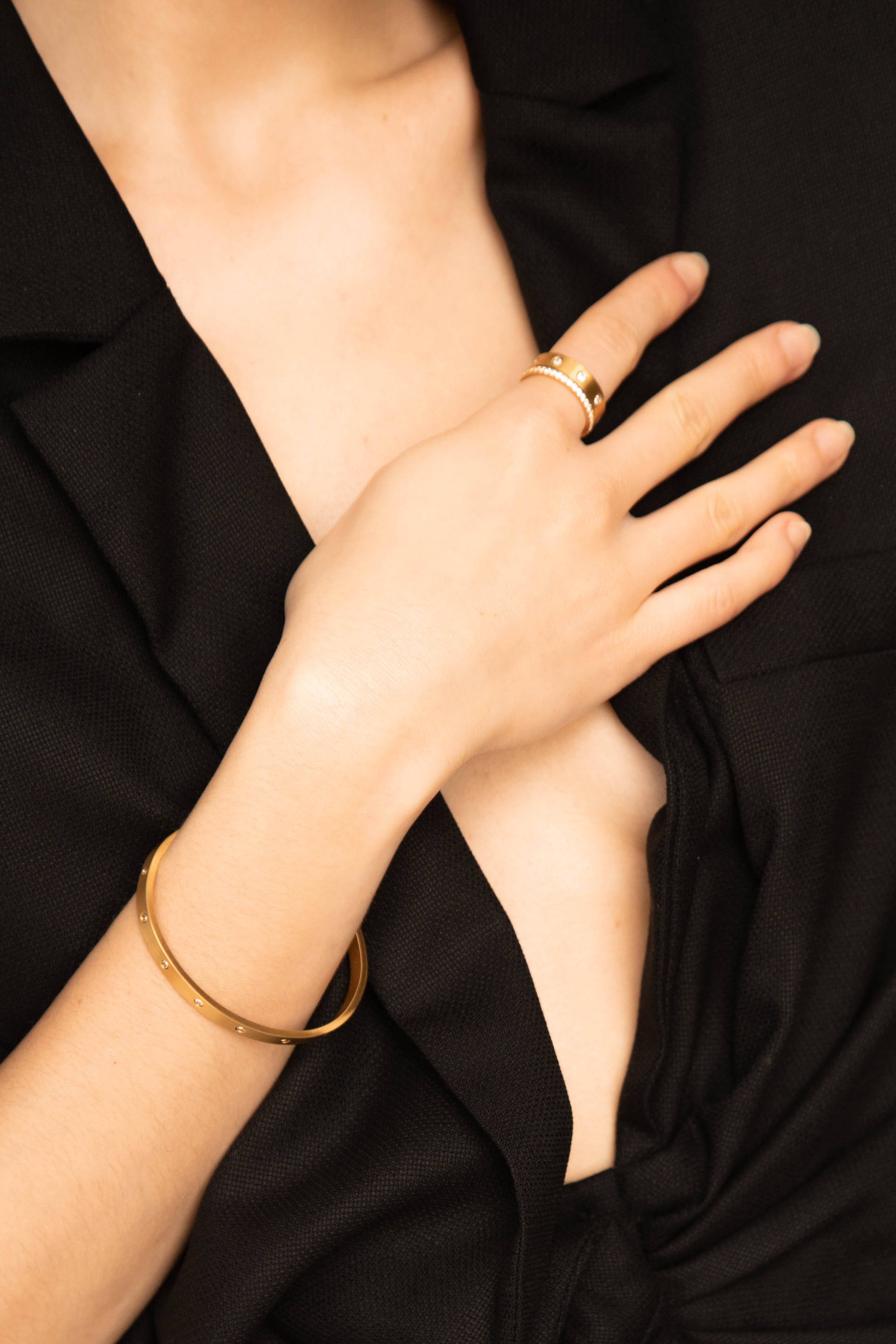 Model wrist and hand with Gemma Diamond Ring and Cuff Bagatiba 