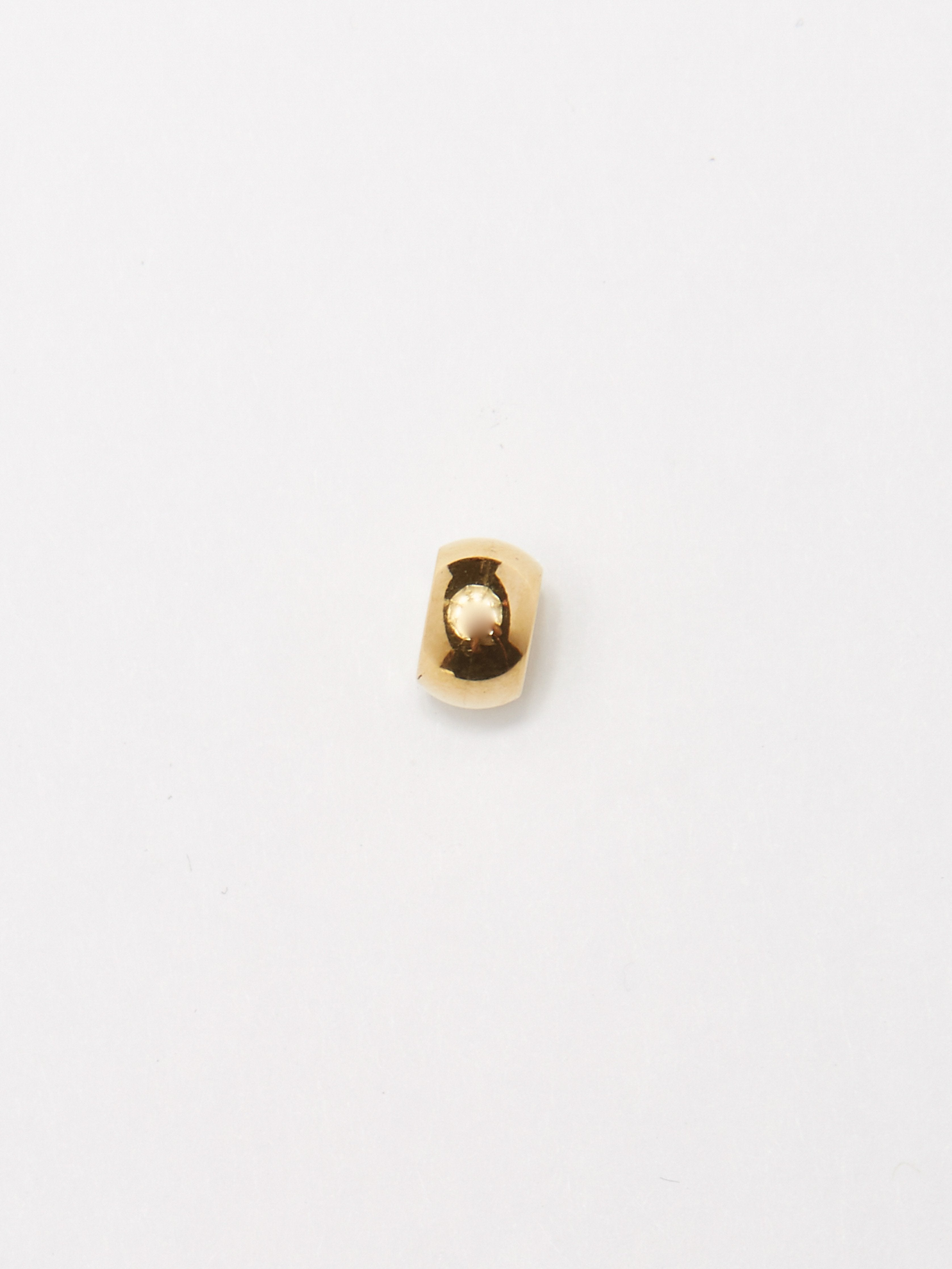 Detail flat lay of the bead from Gold Bead Set Bagatiba 