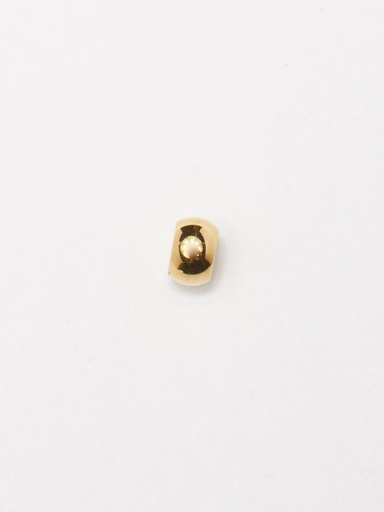 Detail flat lay of the bead from Gold Bead Set Bagatiba 