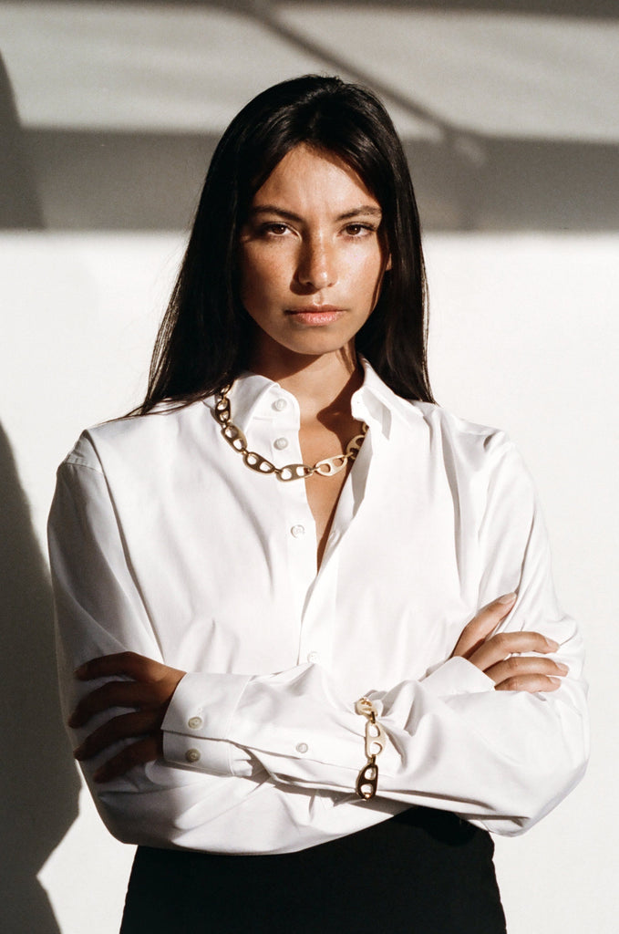 Model photographed in natural light wearing Gold Brushed Tab Bracelet Bracelet bagatiba 