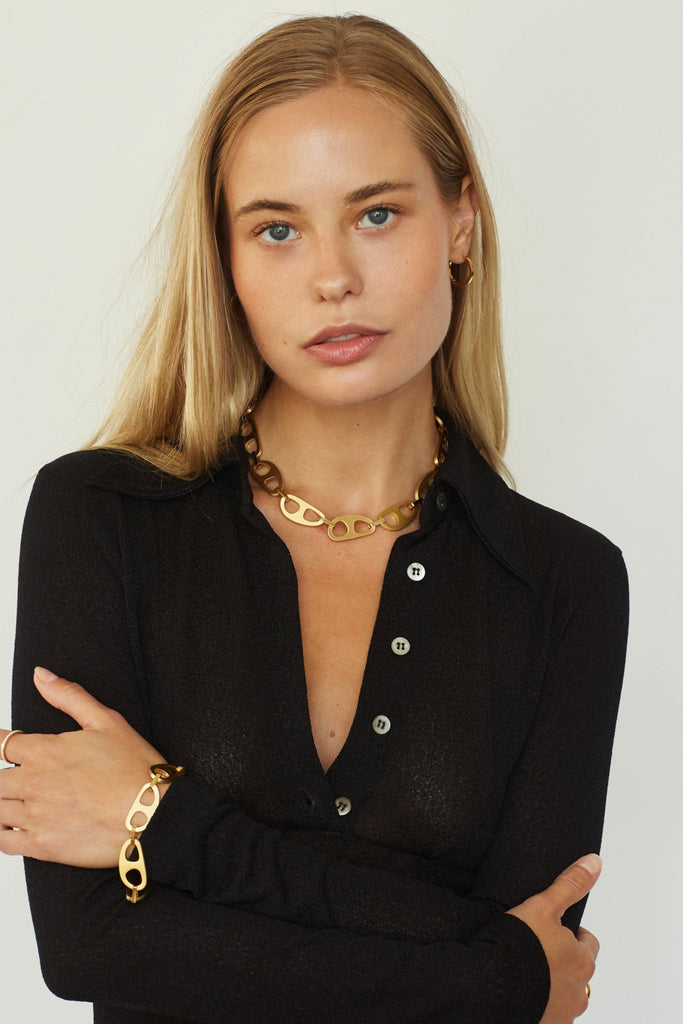 Full view of Model wearing Gold Brushed Tab Bracelet & Necklace bagatiba 
