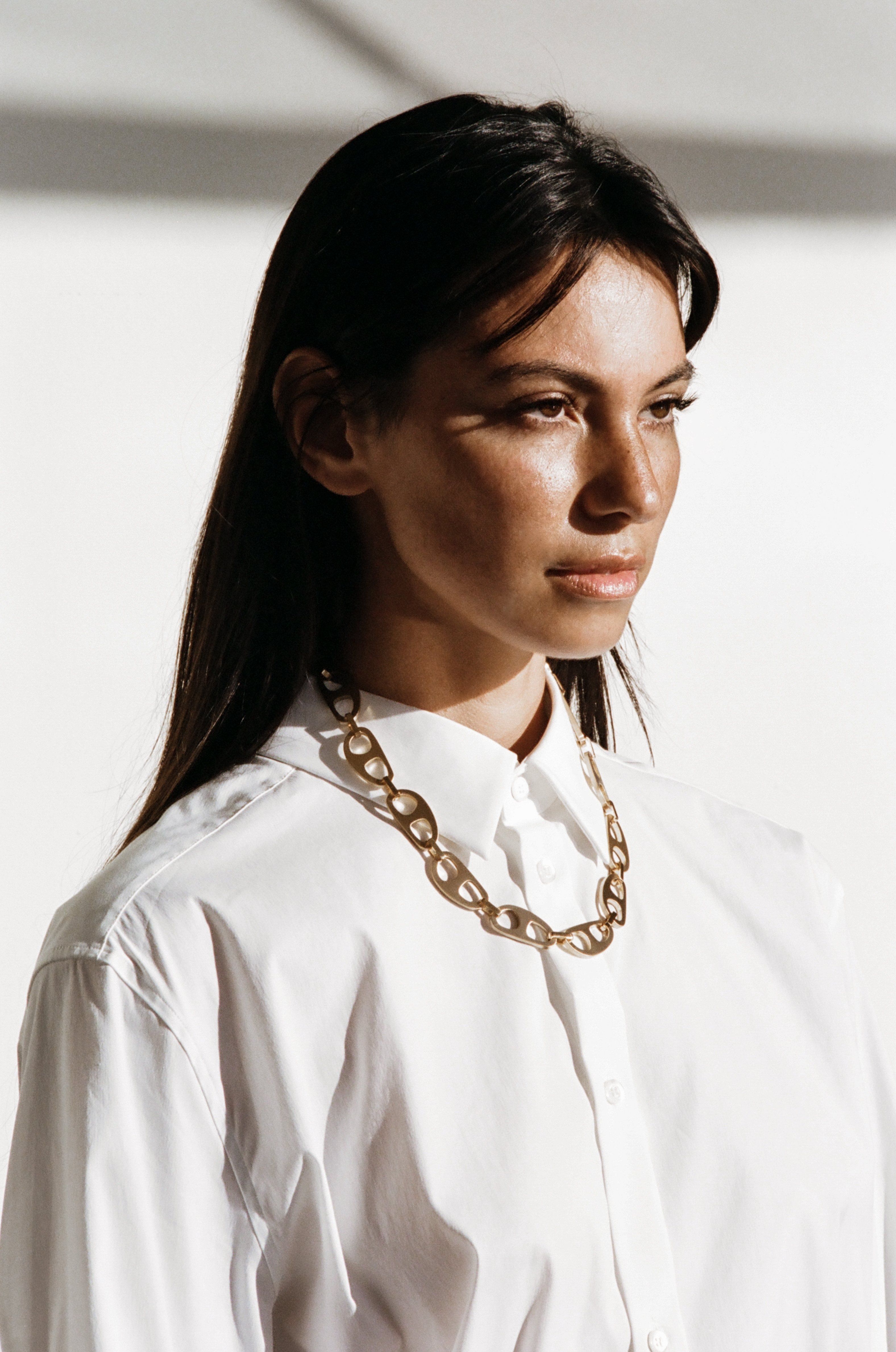 Profile view of model wearing Gold Brushed Tab Necklace Necklace bagatiba 