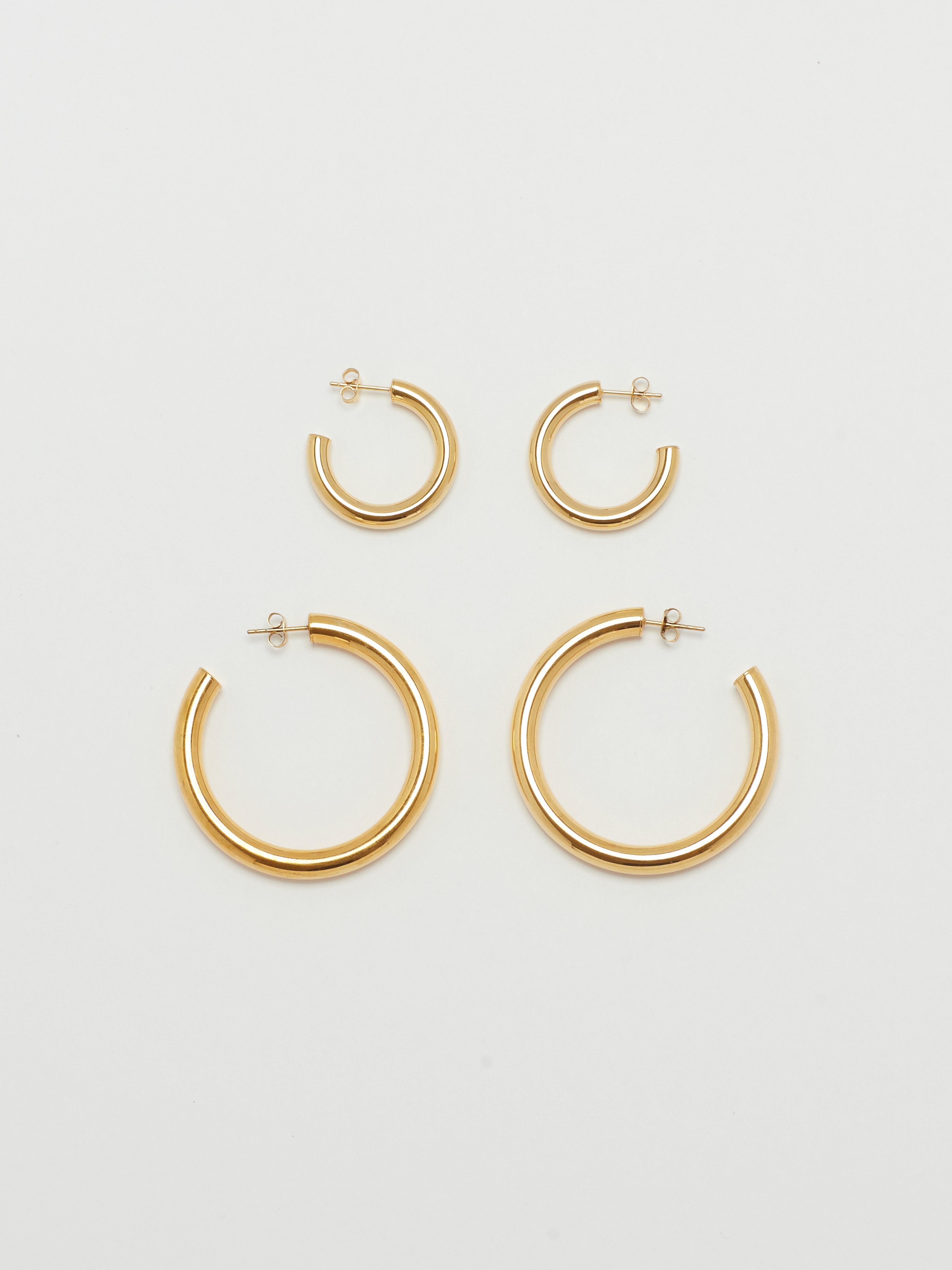 Full view flat lay of Gold Hollow Hoops & Mini Gold Hollow Hoops Earrings Bagatiba 
