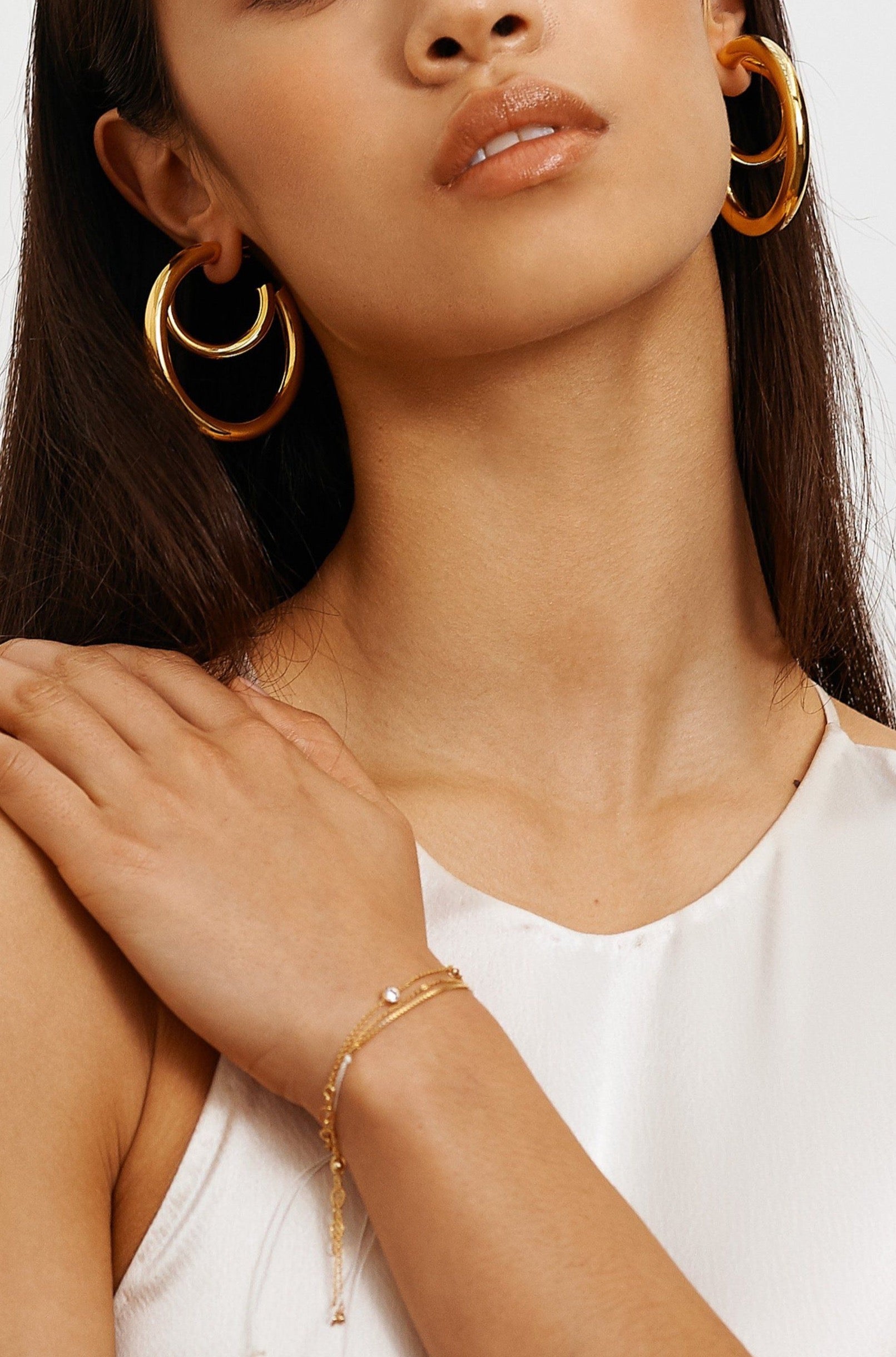 Model wearing Gold Hollow Hoops Earrings Bagatiba 