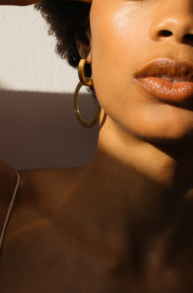 Model wearing the Gold Rita Hoops Earrings Bagatiba 