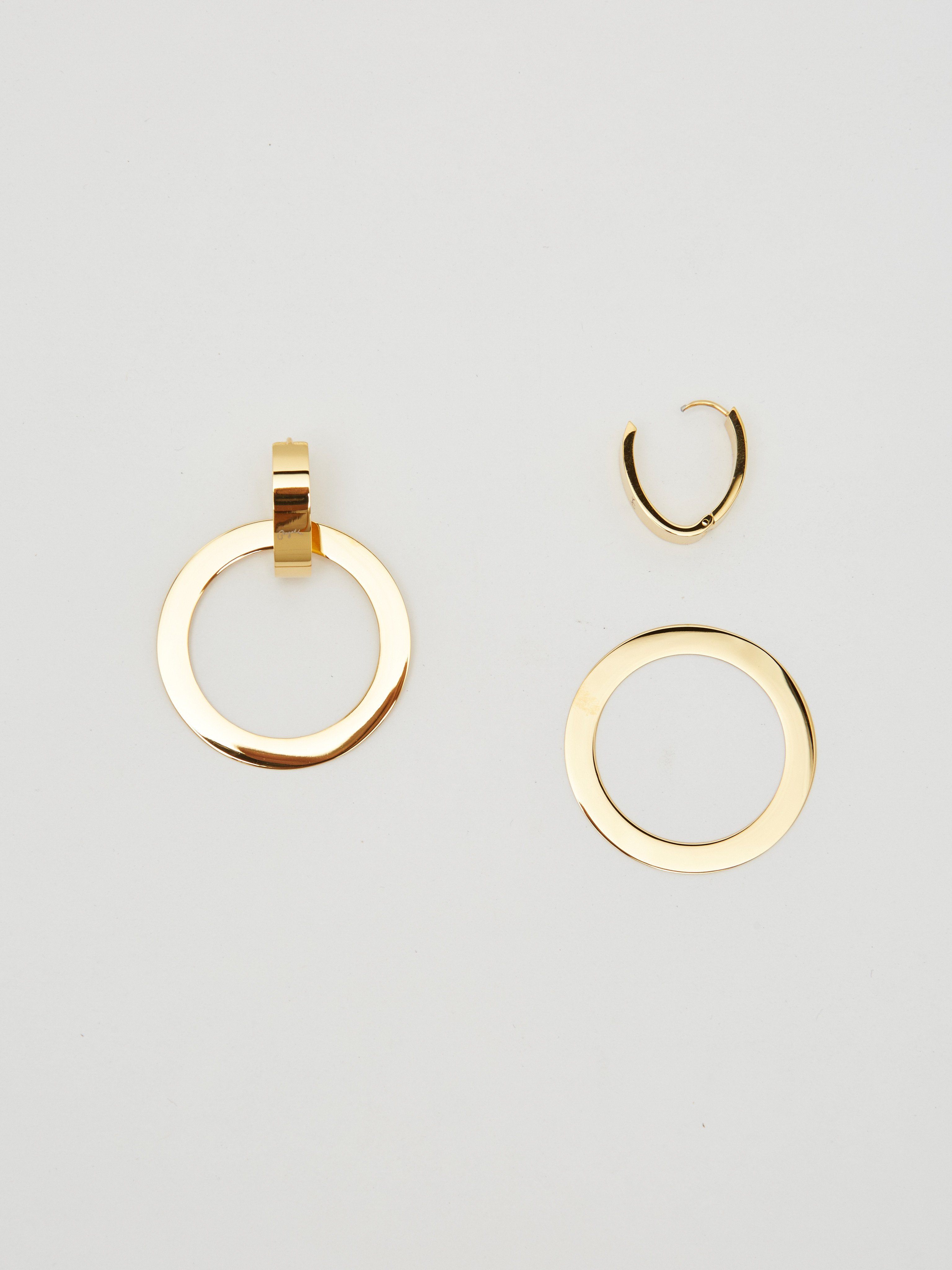 Flat lay view with larger ring removed of Gold Rita Hoops Earrings Bagatiba 