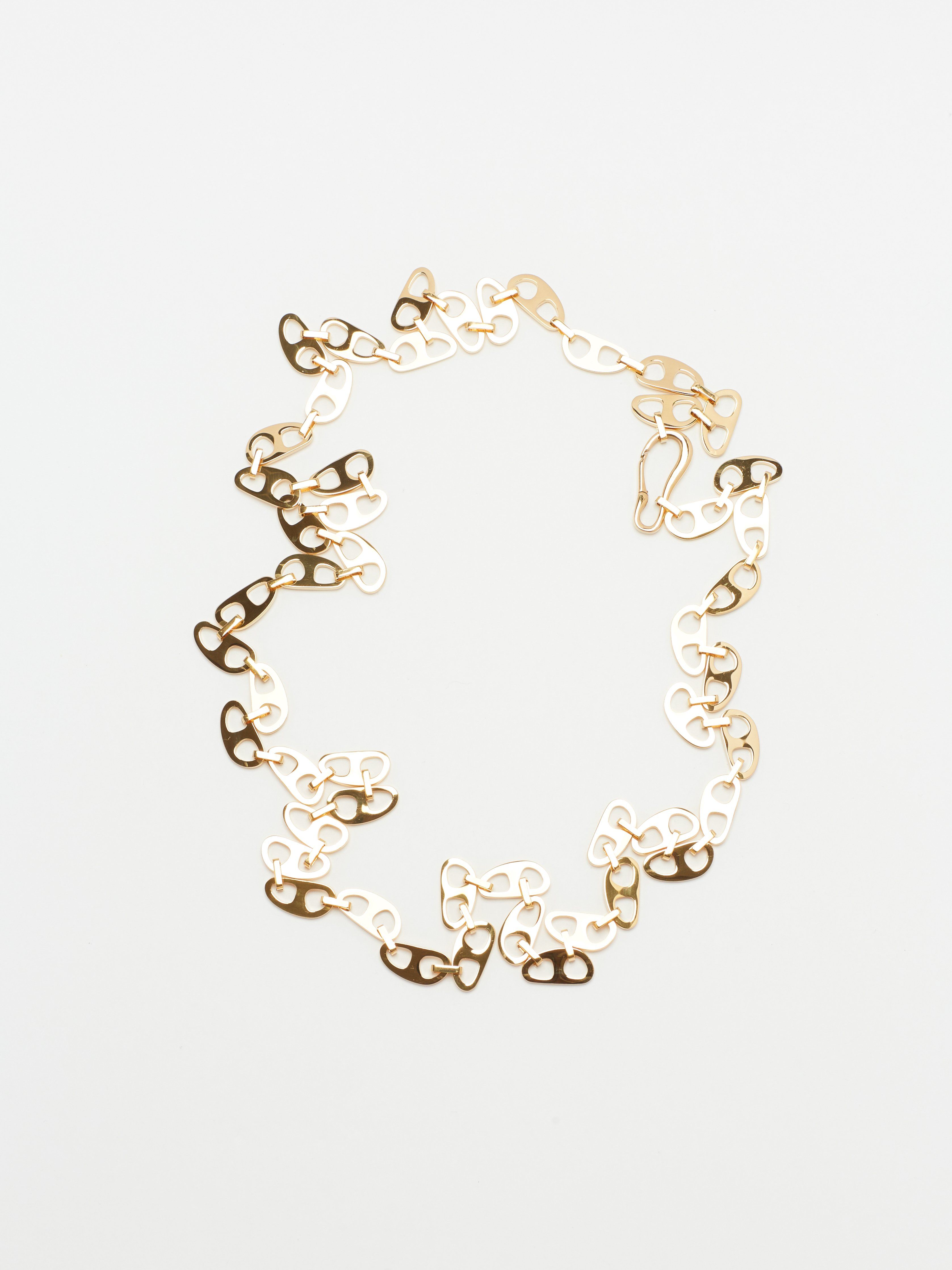 Full view flat lay of the Gold Tab Crossbody Belt Body bagatiba 