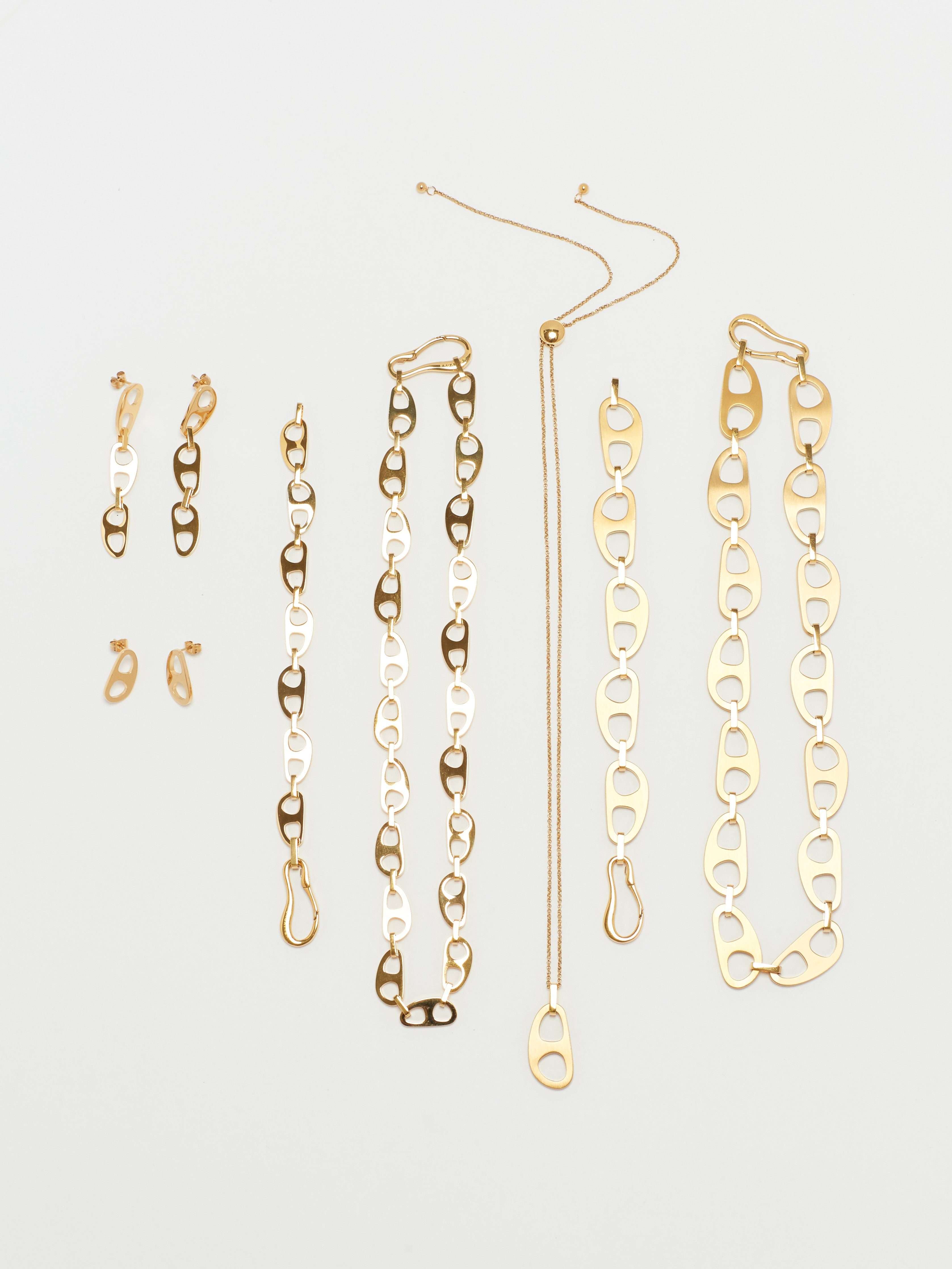 Flat lay of Tab Collection including the Gold Tab Drop Earrings Earrings bagatiba 