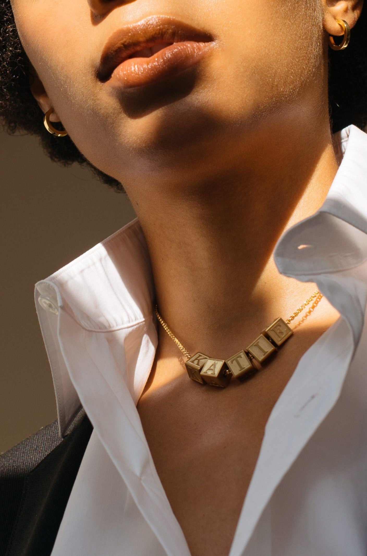 Model wearing 5 Letter Block letters on chain Bagatiba