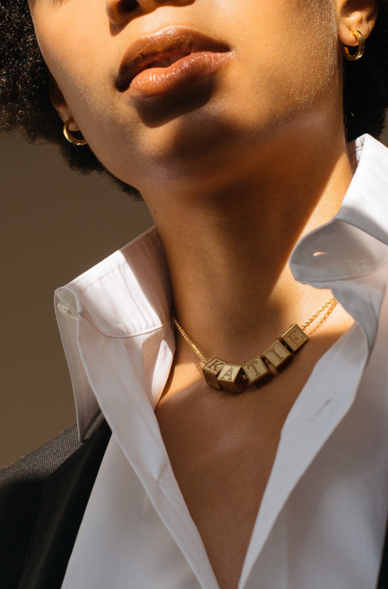 Model wearing 5 Letter Block letters on choker chain Bagatiba