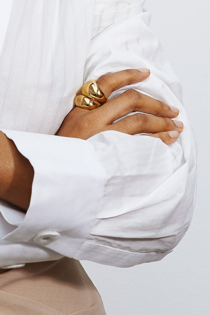 Detail view of hand with Large Gold Orb Ring Ring bagatiba 