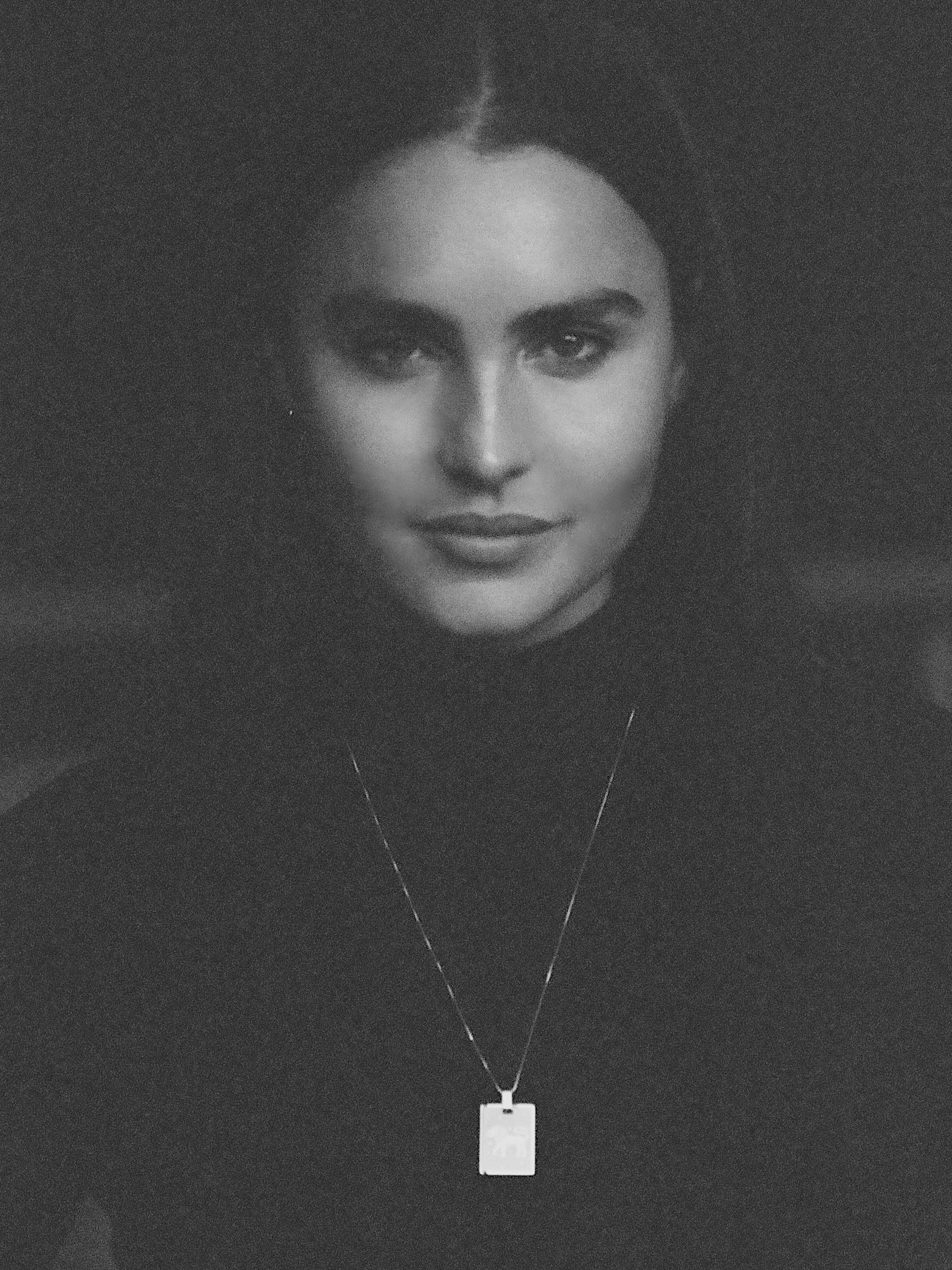 Black & White photo of model wearing Leo Charm charm Bagatiba 