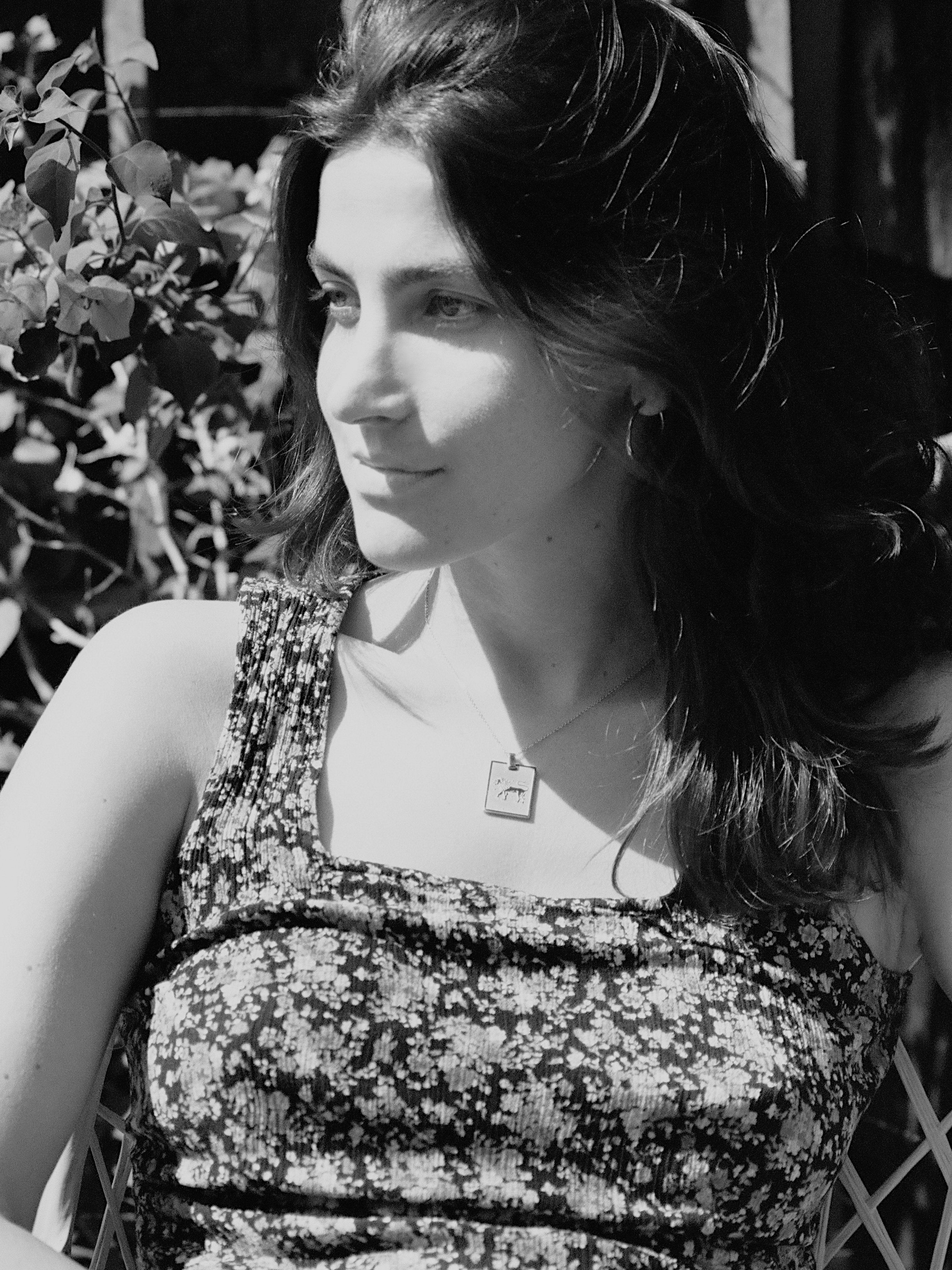 Black & White photo of model wearing Leo Charm charm Bagatiba 