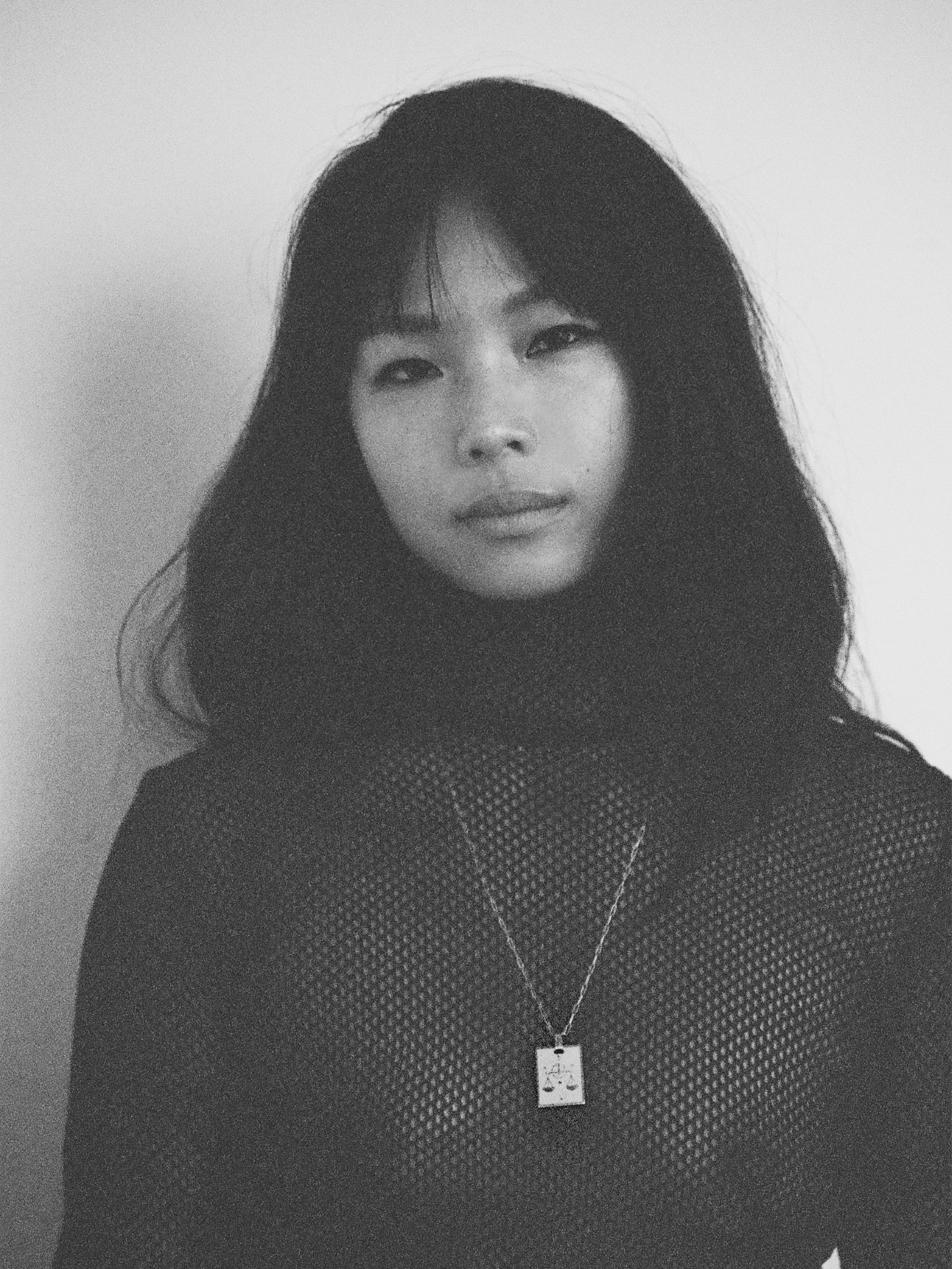 Black & White photo of model wearing Libra Charm charm Bagatiba 