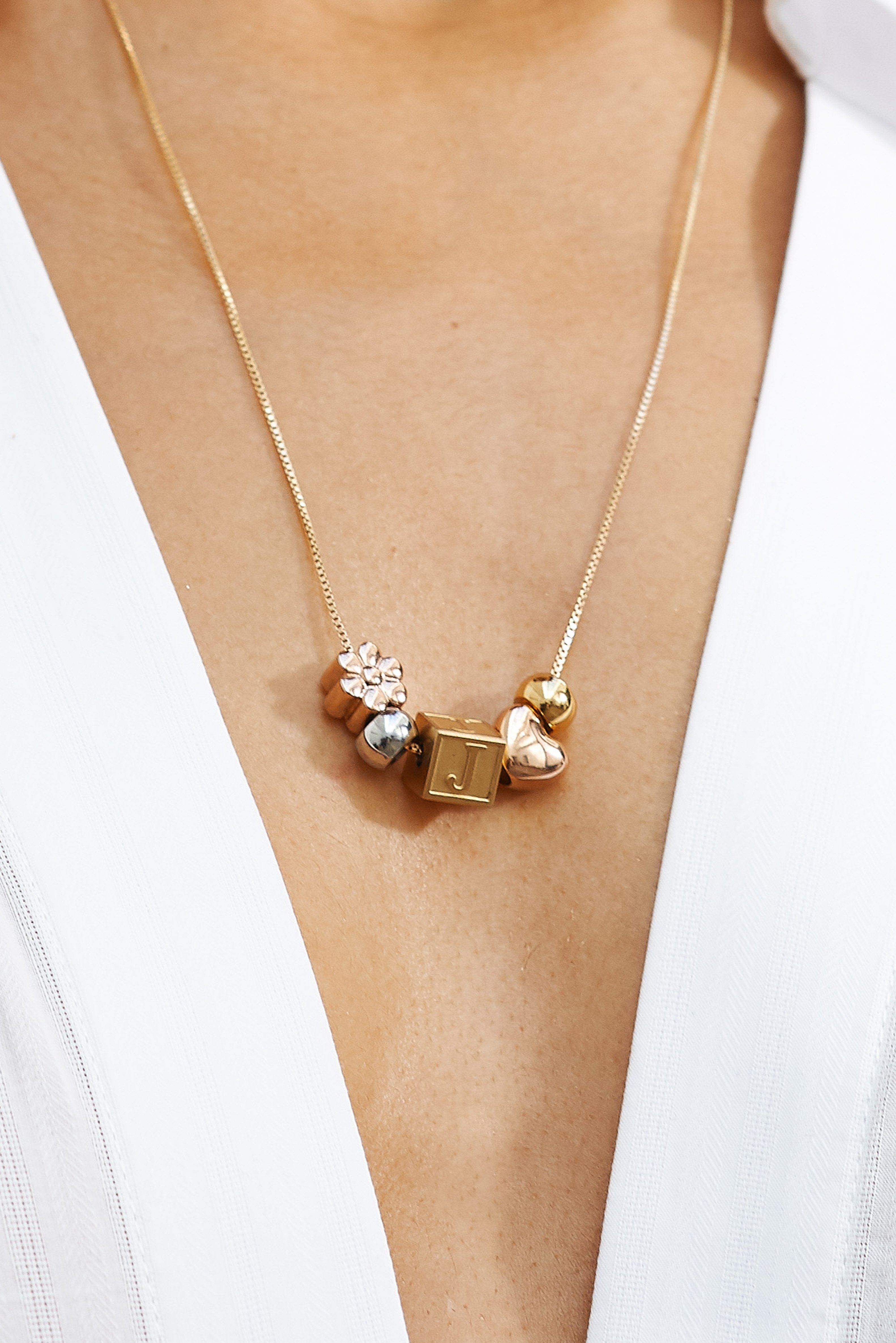 Close up on model of "J" Letter Block letter mixed with multi bead set  Bagatiba 