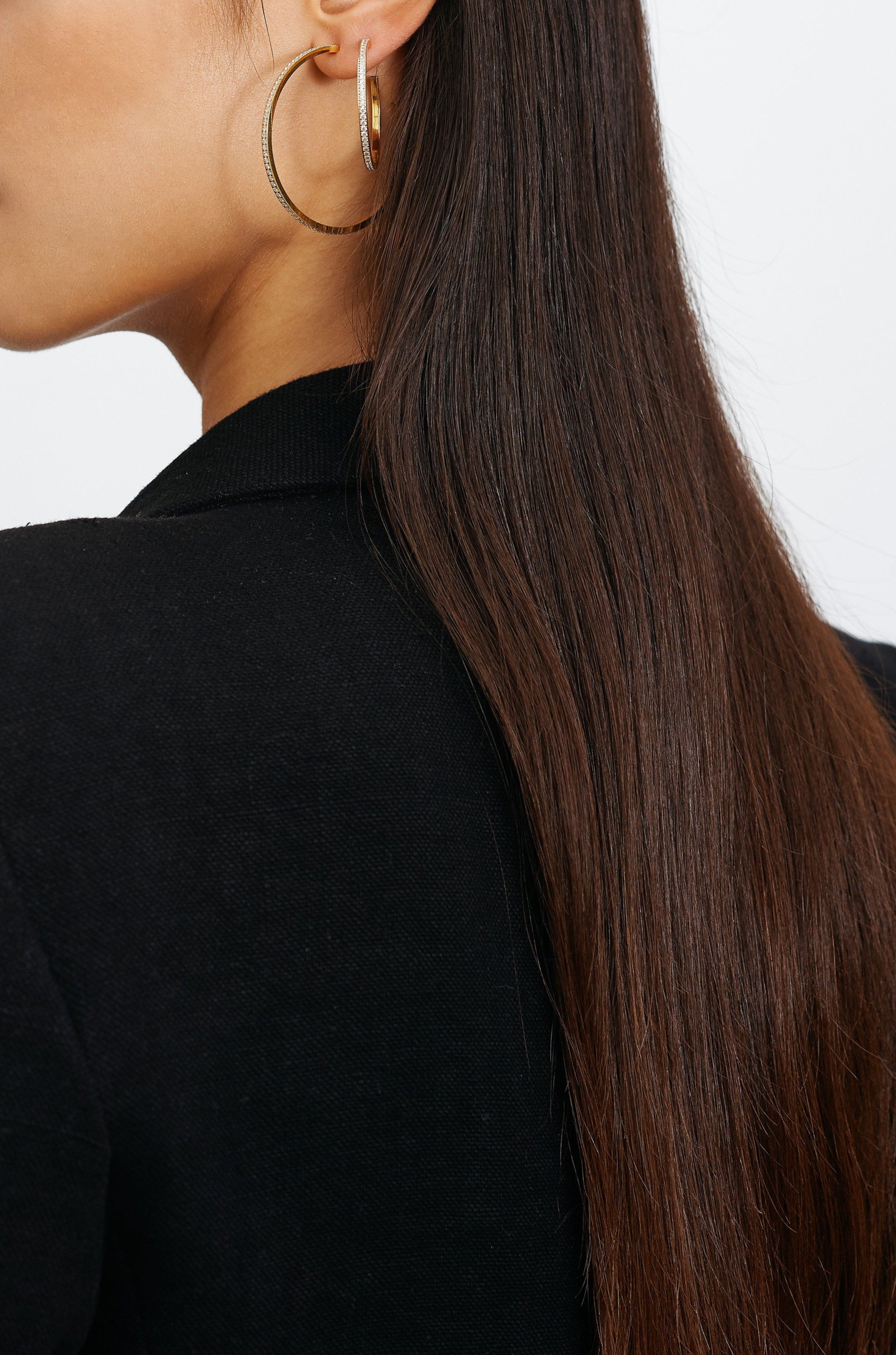 Model side profile view wearing Medium Diamond Hoops Earrings Bagatiba 