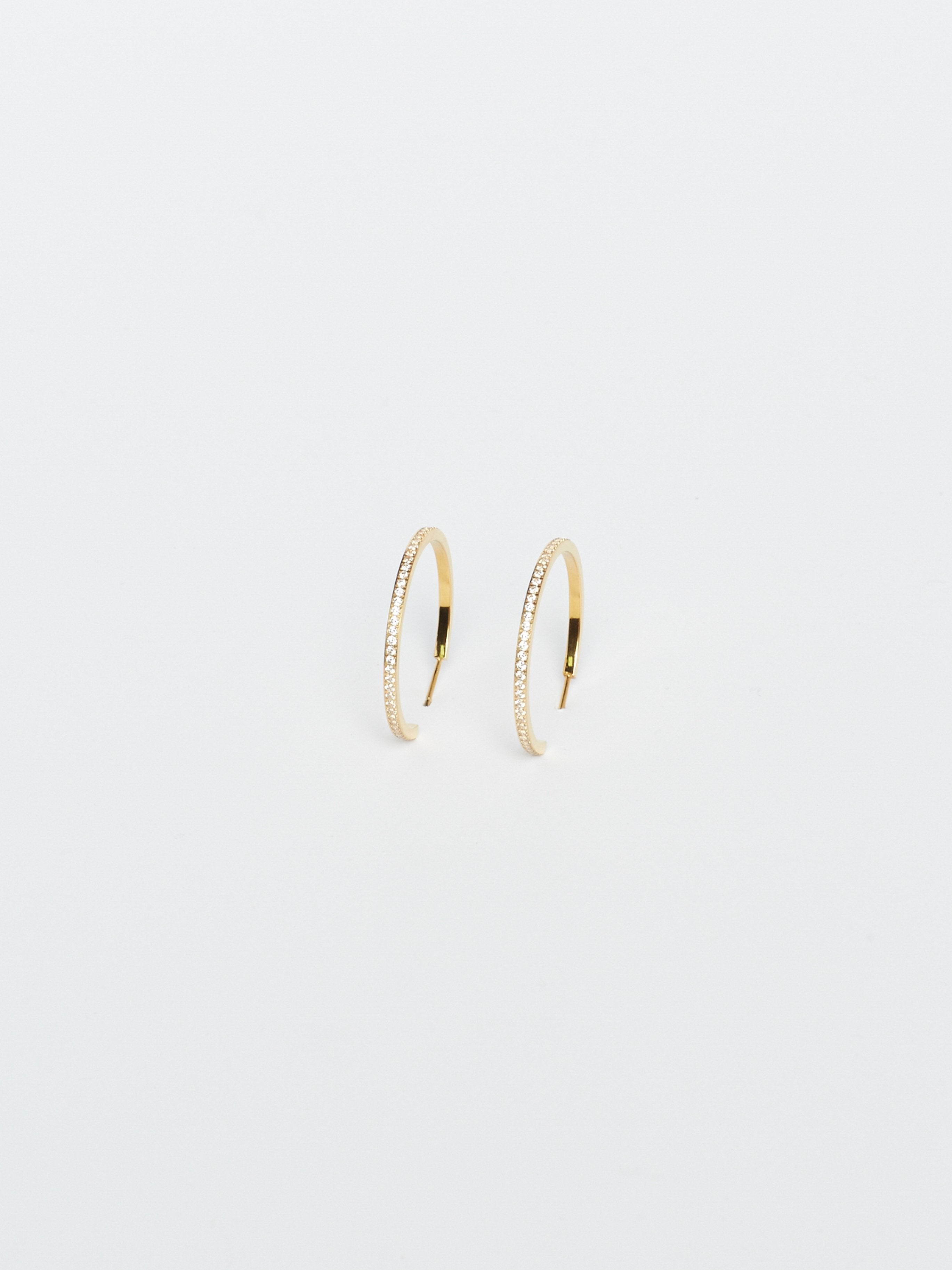 Angled flat lay view of Medium Diamond Hoops Earrings Bagatiba 