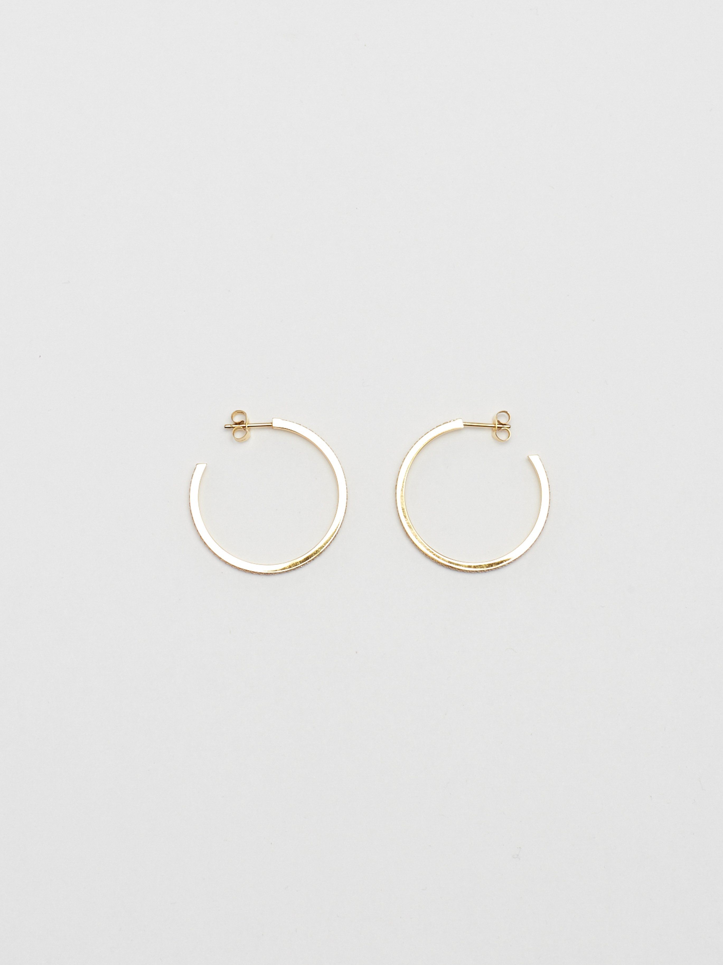 Flat lay of Medium Diamond Hoops Earrings Bagatiba 