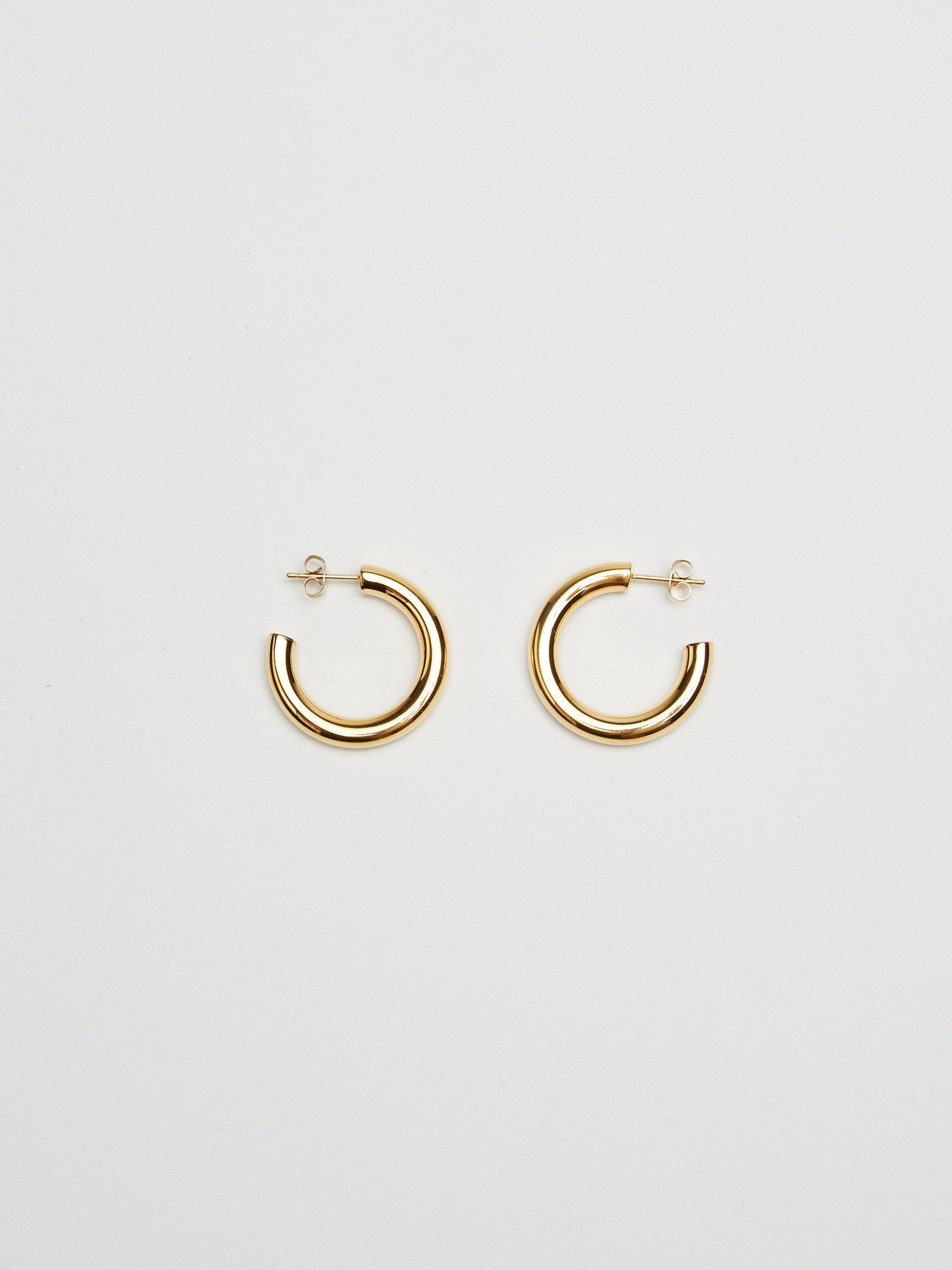 Full view flat lay of Mini Gold Hollow Hoops Earrings Bagatiba 
