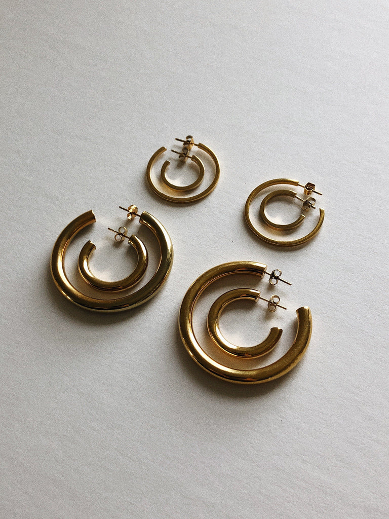 Full collection flat lay with Mini Gold Hollow Hoops Earrings Bagatiba 