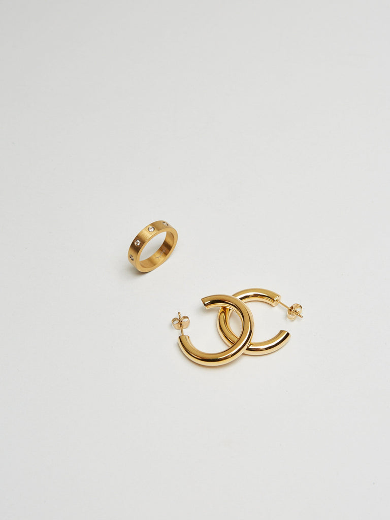 Detail flat lay of Gemma Ring & Mini Gold Hollow Hoops Earrings Bagatiba 