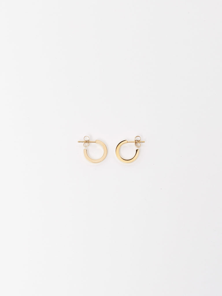 Flat lay of Mini Simple Gold Hoops Earrings Bagatiba 